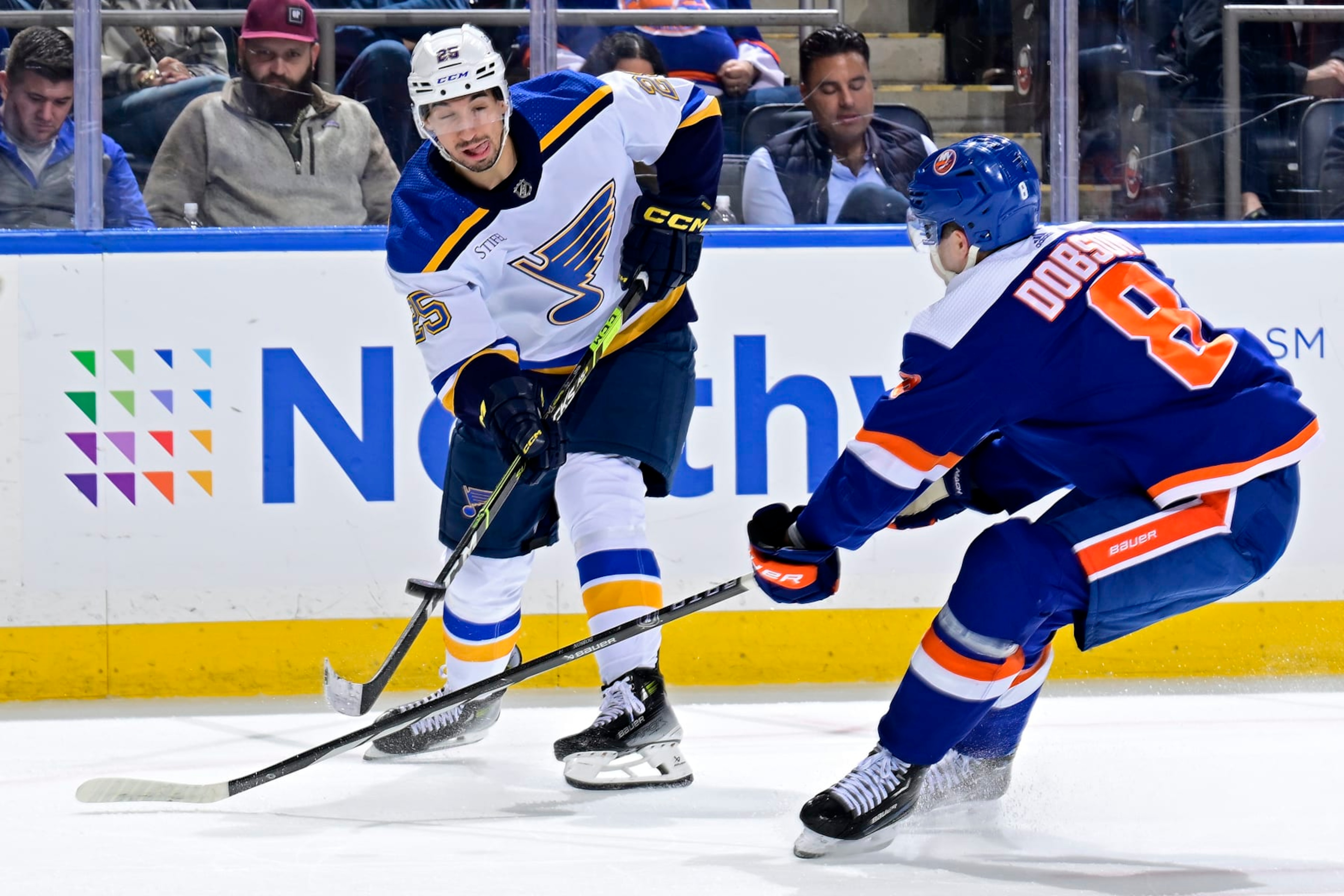ELMONT, NEW YORK - MARCH 05: Jordan Kyrou #25 of the St. Louis Blues is defended by Noah Dobson #8 of the New York Islanders during the second period at UBS Arena on March 05, 2024 in Elmont, New York. (Photo by Steven Ryan/NHLI via Getty Images) ELMONT, NEW YORK - MARCH 05: Jordan Kyrou #25 of the St. Louis Blues is defended by Noah Dobson #8 of the New York Islanders during the second period at UBS Arena on March 05, 2024 in Elmont, New York. (Photo by Steven Ryan/NHLI via Getty Images)