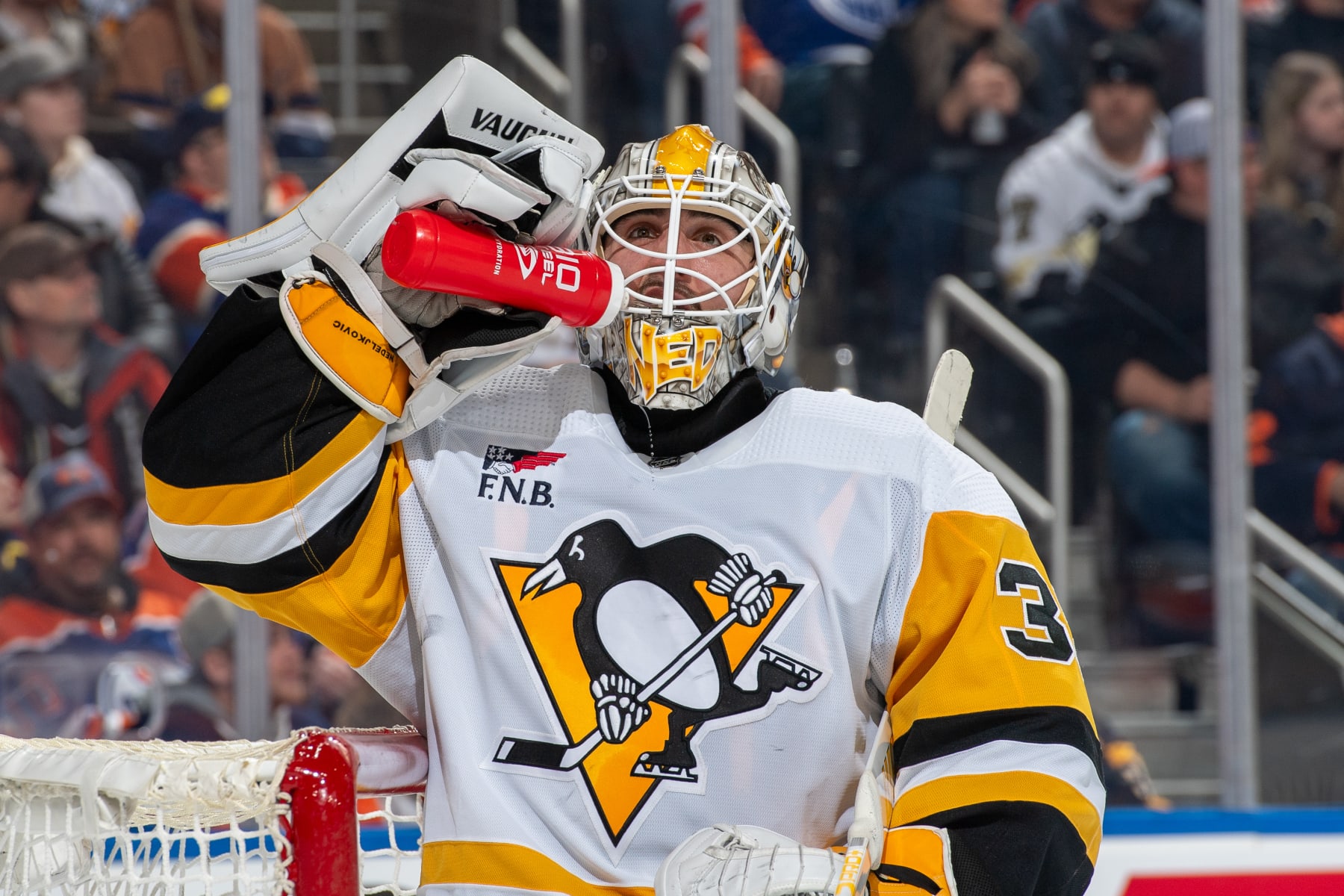 EDMONTON, CANADA - MARCH 3: Goaltender Alex Nedeljkovic #39 of the Pittsburgh Penguins takes a drink during a stoppage in play during the game against the Edmonton Oilers at Rogers Place on March 03, 2024, in Edmonton, Alberta, Canada. (Photo by Andy Devlin/NHLI via Getty Images)