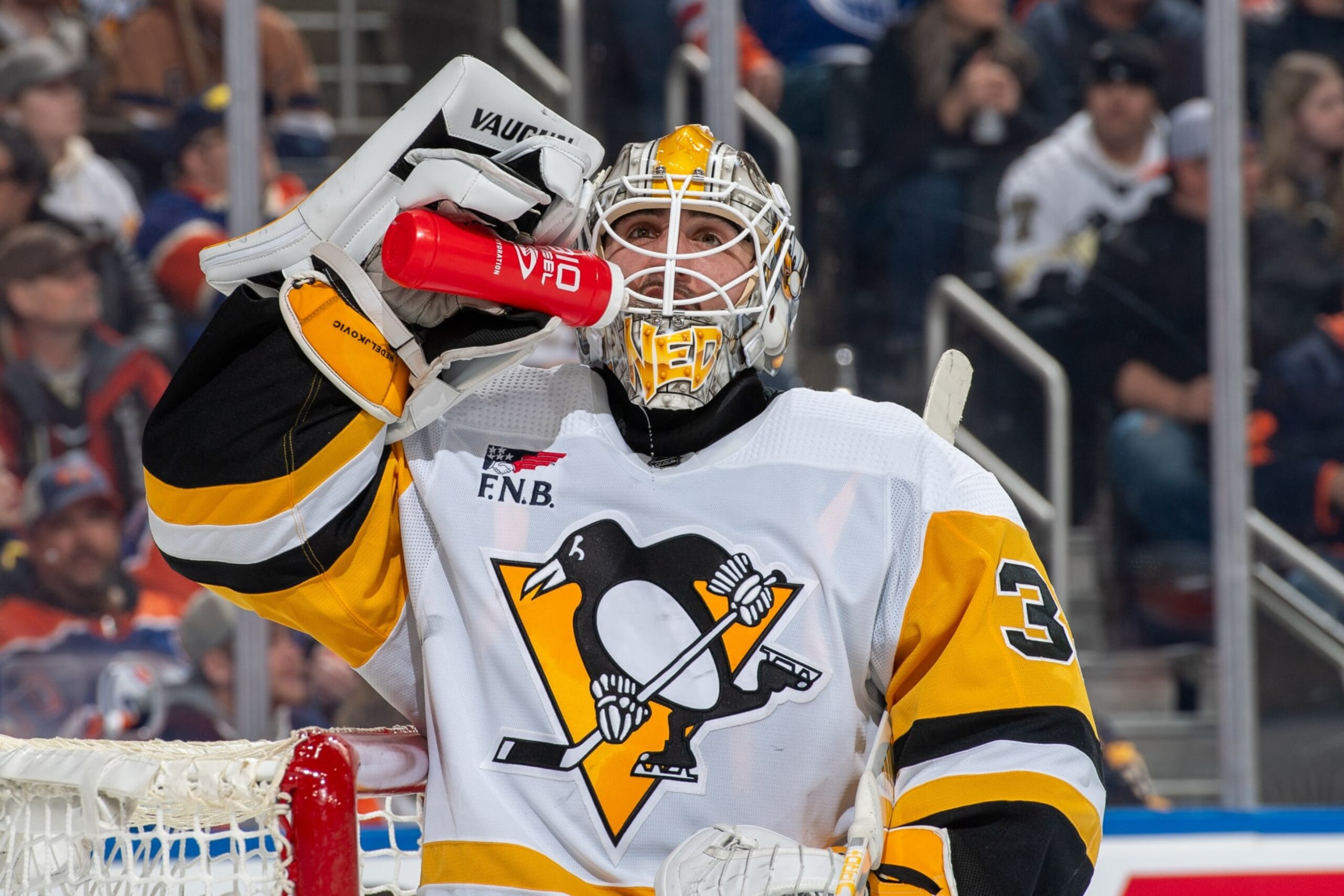EDMONTON, CANADA - MARCH 3: Goaltender Alex Nedeljkovic #39 of the Pittsburgh Penguins takes a drink during a stoppage in play during the game against the Edmonton Oilers at Rogers Place on March 03, 2024, in Edmonton, Alberta, Canada. (Photo by Andy Devlin/NHLI via Getty Images)