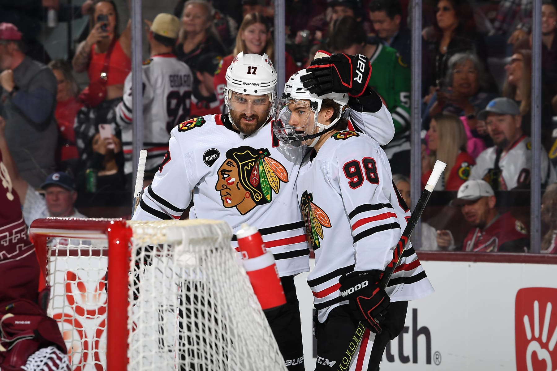 TEMPE, ARIZONA - MARCH 05: Nick Foligno #17 of the Chicago Blackhawks celebrates with teammate Connor Bedard #98 after scoring a goal against the Arizona Coyotes during the second period of the game at Mullett Arena on March 05, 2024 in Tempe, Arizona. (Photo by Norm Hall/NHLI via Getty Images)