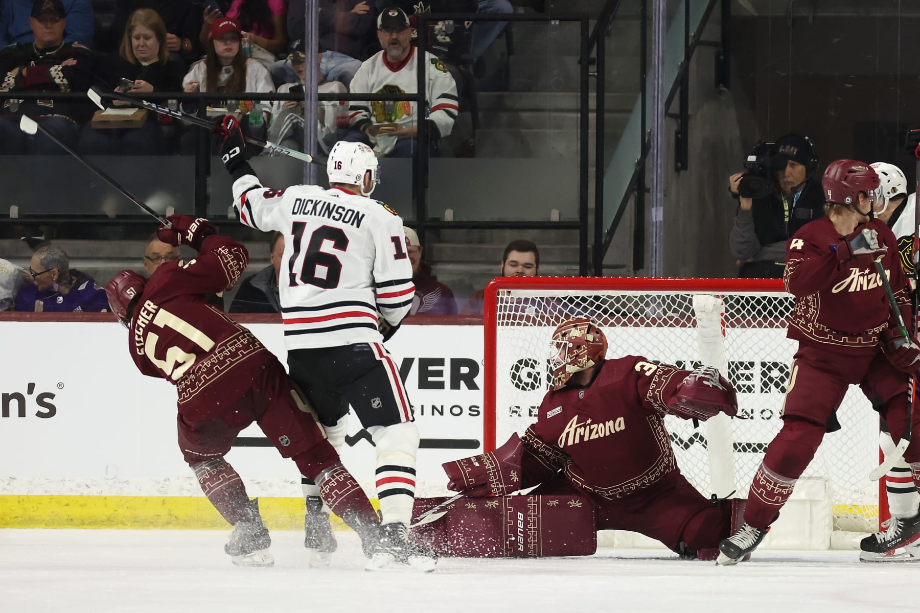 TEMPE, ARIZONA - MARCH 05: Jason Dickinson #16 of the Chicago Blackhawks scores a power-play goal against goaltender Connor Ingram #39 of the Arizona Coyotes during the second period of the NHL game at Mullett Arena on March 05, 2024 in Tempe, Arizona. (Photo by Christian Petersen/Getty Images)