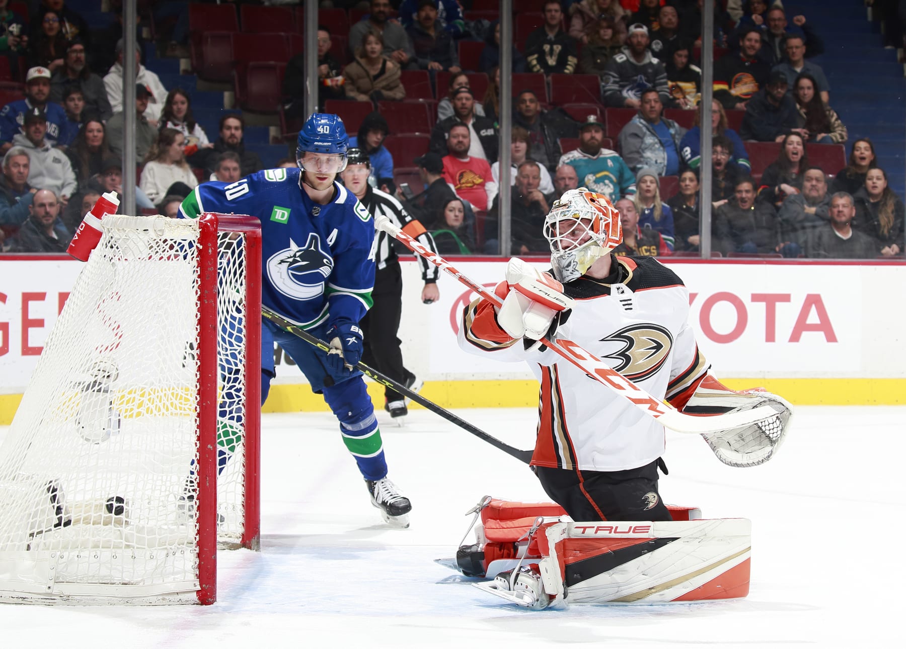 VANCOUVER, CANADA - MARCH 8: J.T. Miller #9 of the Vancouver Canucks scores a goal on Lukas Dostal #1 of the Anaheim Ducks during the first period of their NHL game at Rogers Arena March 8, 2023 in Vancouver, British Columbia, Canada.  (Photo by Jeff Vinnick/NHLI via Getty Images)