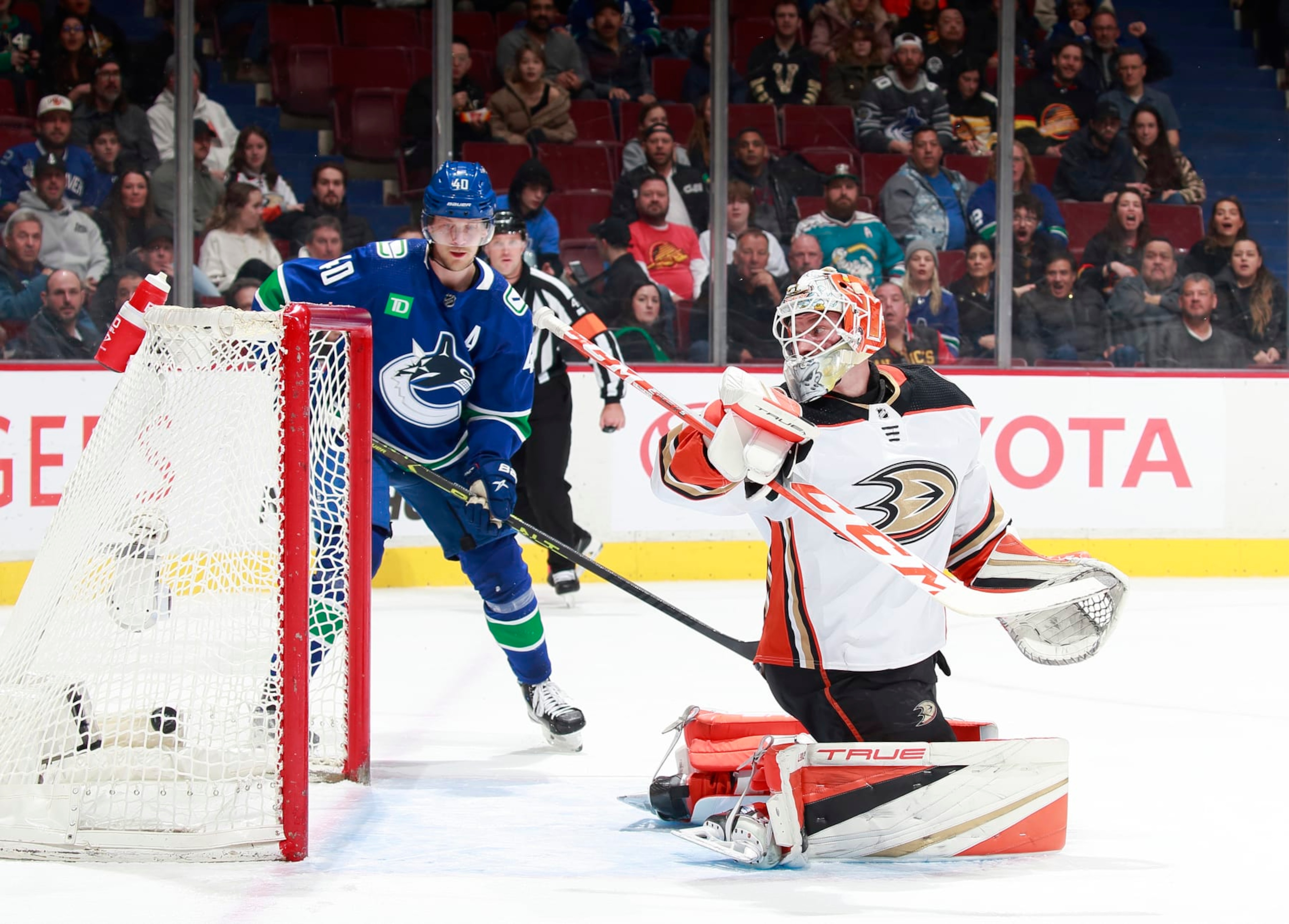 VANCOUVER, CANADA - MARCH 8: J.T. Miller #9 of the Vancouver Canucks scores a goal on Lukas Dostal #1 of the Anaheim Ducks during the first period of their NHL game at Rogers Arena March 8, 2023 in Vancouver, British Columbia, Canada. (Photo by Jeff Vinnick/NHLI via Getty Images) VANCOUVER, CANADA - MARCH 8: J.T. Miller #9 of the Vancouver Canucks scores a goal on Lukas Dostal #1 of the Anaheim Ducks during the first period of their NHL game at Rogers Arena March 8, 2023 in Vancouver, British Columbia, Canada. (Photo by Jeff Vinnick/NHLI via Getty Images)