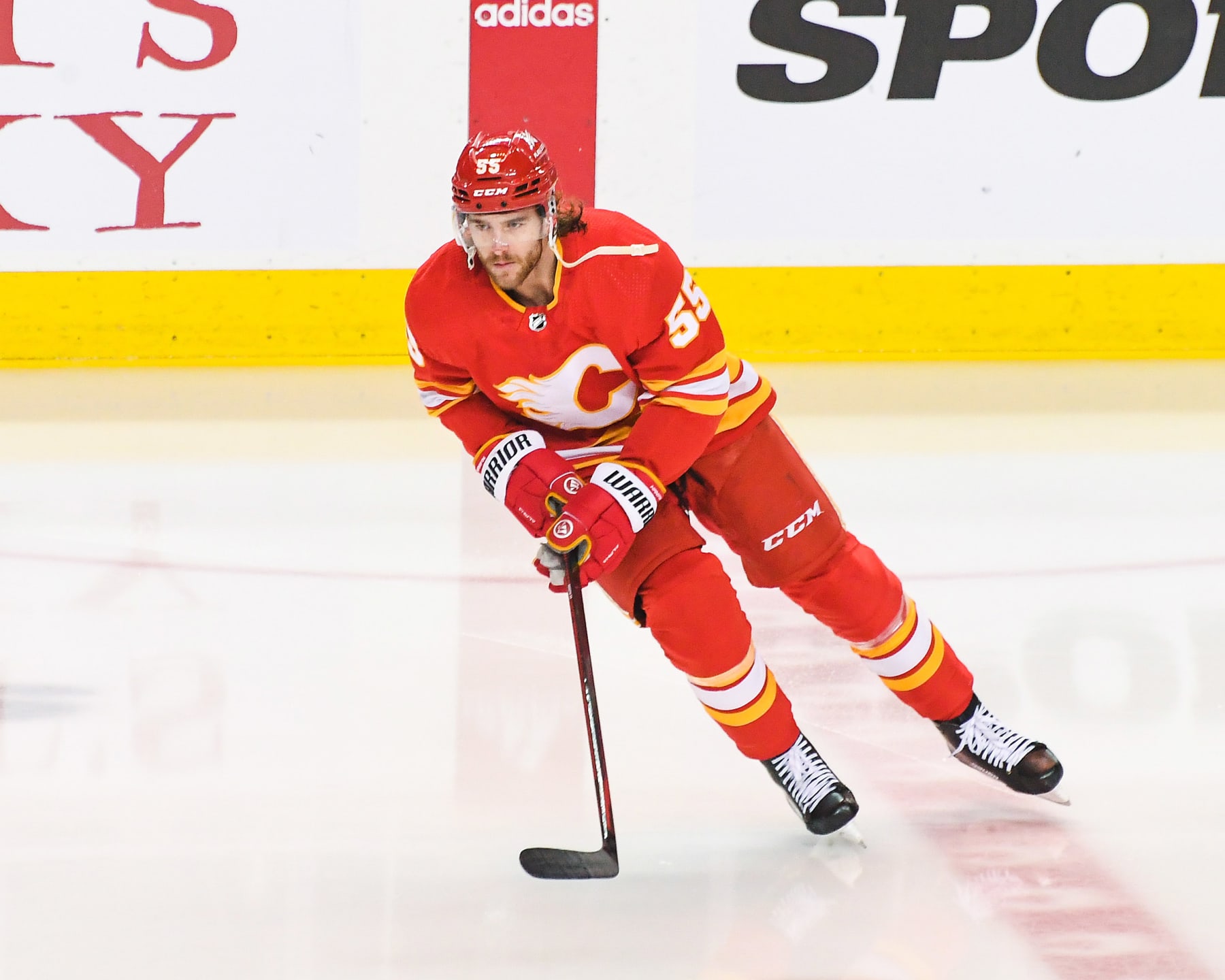 CALGARY, CANADA - FEBRUARY 22: Noah Hanifin #55 of the Calgary Flames in action against the Boston Bruins during an NHL game at Scotiabank Saddledome on February 22, 2024 in Calgary, Alberta, Canada.  (Photo by Derek Leung/Getty Images)