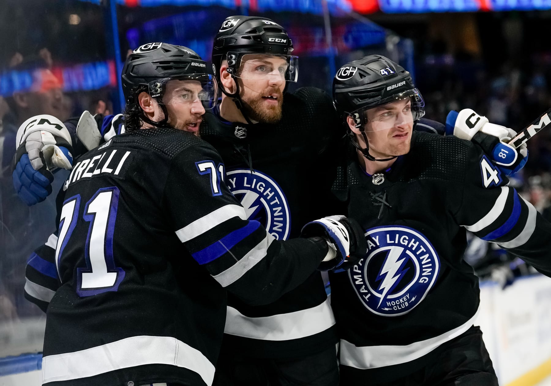 TAMPA, FL - MARCH 02: Tampa Bay Lightning center Anthony Cirelli (71) shoots and scores a goal tying the game at 2 and celebrates with Tampa Bay Lightning right wing Mitchell Chaffee (41) and Tampa Bay Lightning defenseman Erik Cernak (81) during the NHL Hockey match between the Tampa Bay Lightning and Montreal Canadians on March 2nd, 2024 at Amalie Arena in Tampa, FL. (Photo by Andrew Bershaw/Icon Sportswire via Getty Images)