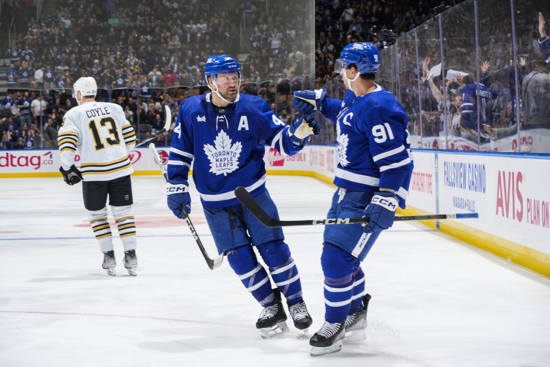 TORONTO, ON - MARCH 4: John Tavares #91 of the Toronto Maple Leafs celebrates his goal against the Boston Bruins with teammate Morgan Rielly #44 during the third period at Scotiabank Arena on March 4, 2024 in Toronto, Ontario, Canada. (Photo by Mark Blinch/NHLI via Getty Images)