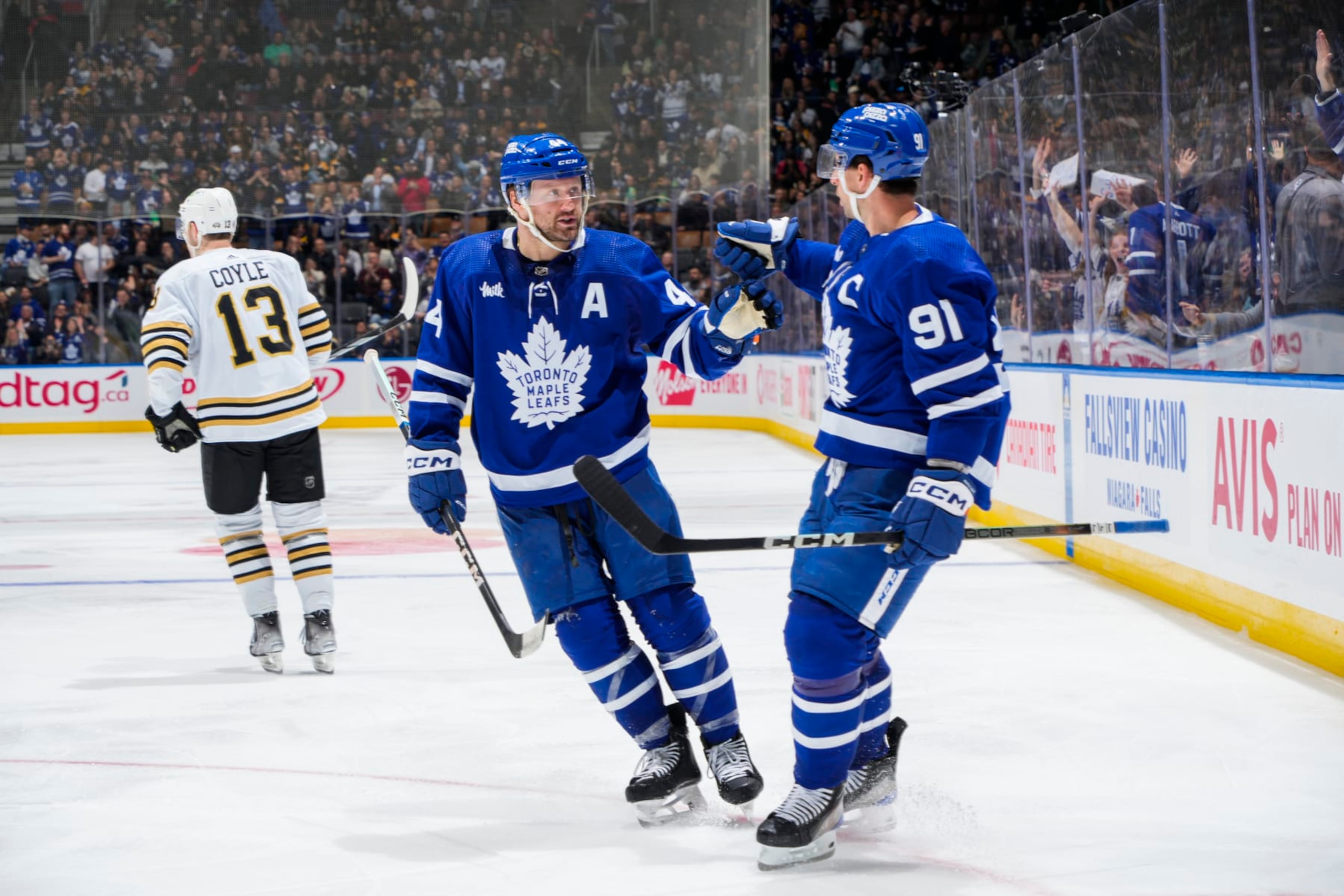 TORONTO, ON - MARCH 4: John Tavares #91 of the Toronto Maple Leafs celebrates his goal against the Boston Bruins with teammate Morgan Rielly #44 during the third period at Scotiabank Arena on March 4, 2024 in Toronto, Ontario, Canada. (Photo by Mark Blinch/NHLI via Getty Images)