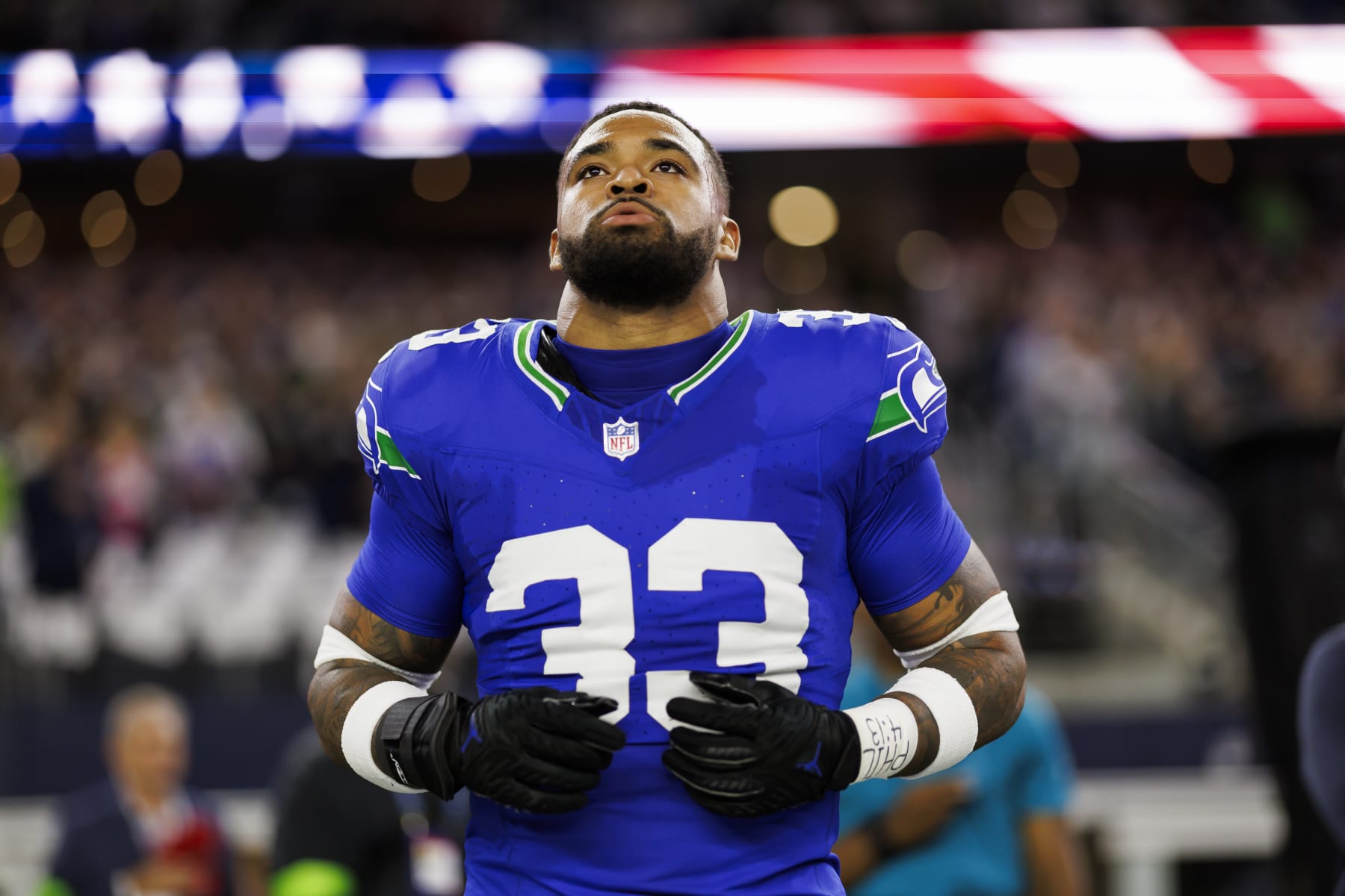 ARLINGTON, TEXAS - NOVEMBER 30: Jamal Adams #33 of the Seattle Seahawks looks on from the sideline before an NFL football game against the Dallas Cowboys at AT&T Stadium on November 30, 2023 in Arlington, Texas. (Photo by Ryan Kang/Getty Images)