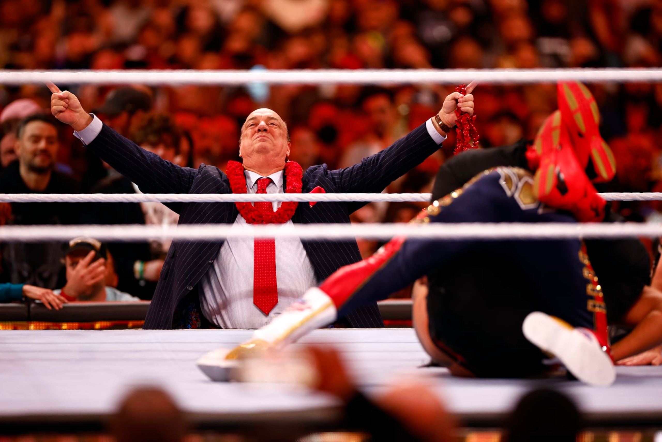 INGLEWOOD, CALIFORNIA - APRIL 02:  (L-R) Paul Heyman watches Cody Rhodes wrestle Roman Reigns for Undisputed WWE Universal Title Match during WrestleMania Goes Hollywood at SoFi Stadium on April 02, 2023 in Inglewood, California.
 (Photo by Ronald Martinez/Getty Images)