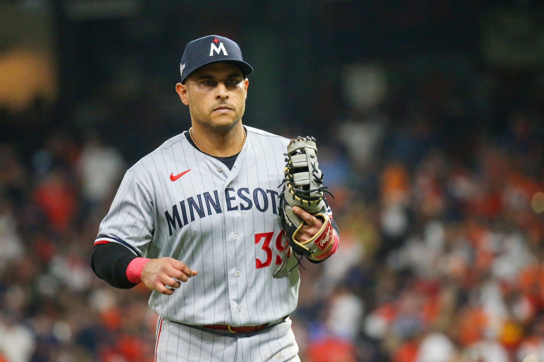 HOUSTON, TX - OCTOBER 08: Minnesota Twins first baseman Donovan Solano (39) returns to dugout following the bottom of the fourth inning during the Major League Baseball ALDS Game 2 between the Minnesota Twins and Houston Astros on October 8, 2023 at Minute Maid Park in Houston, Texas. (Photo by Leslie Plaza Johnson/Icon Sportswire via Getty Images)