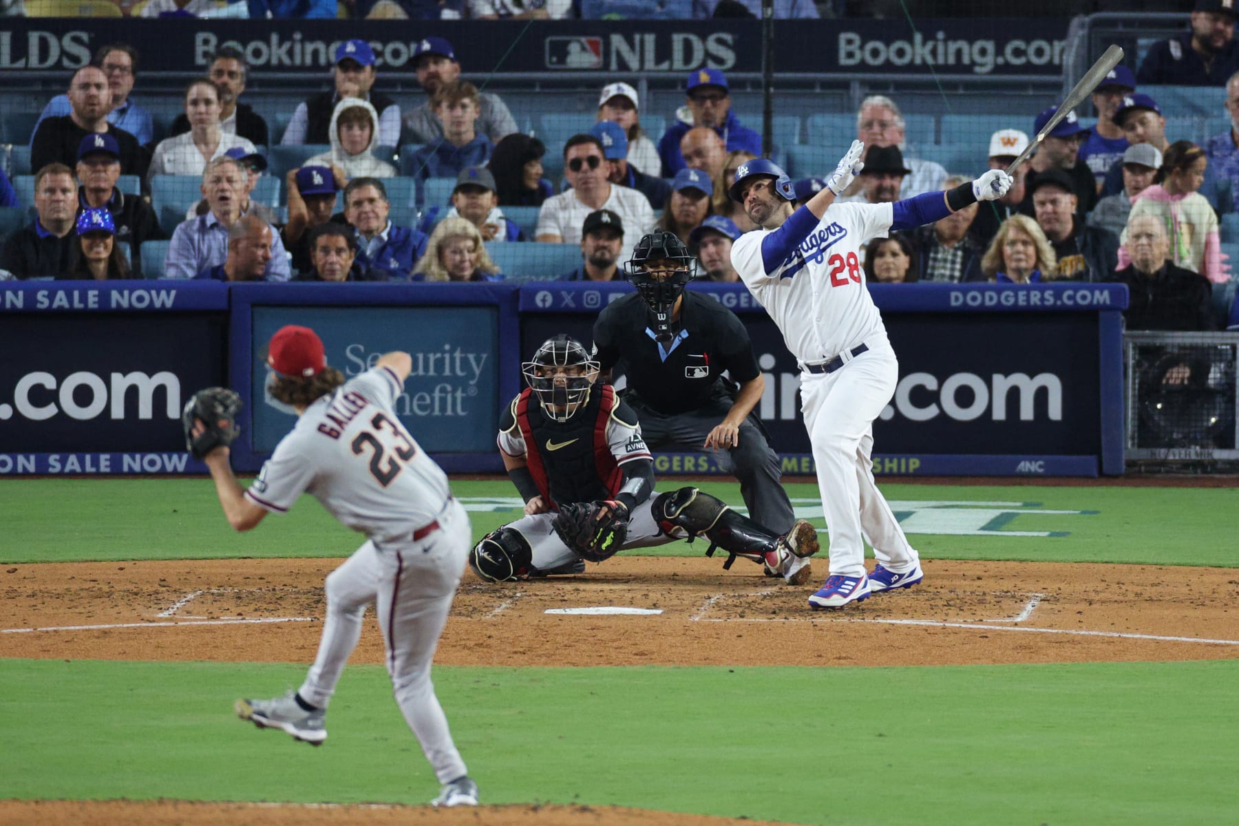 LOS ANGELES, CALIFORNIA - OCTOBER 09: J.D. Martinez #28 of the Los Angeles Dodgers hits a solo home run against the Arizona Diamondbacks during the fourth inning in Game Two of the Division Series at Dodger Stadium on October 09, 2023 in Los Angeles, California. (Photo by Kevork Djansezian/Getty Images)