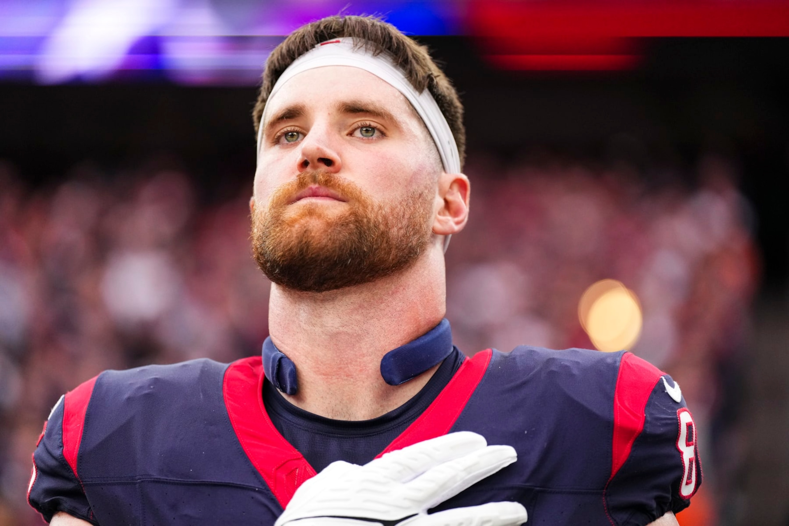 HOUSTON, TX - JANUARY 13: Dalton Schultz #86 of the Houston Texans looks on from the sideline prior to an NFL wild-card playoff football game against the Cleveland Browns at NRG Stadium on January 13, 2024 in Houston, Texas. (Photo by Cooper Neill/Getty Images)