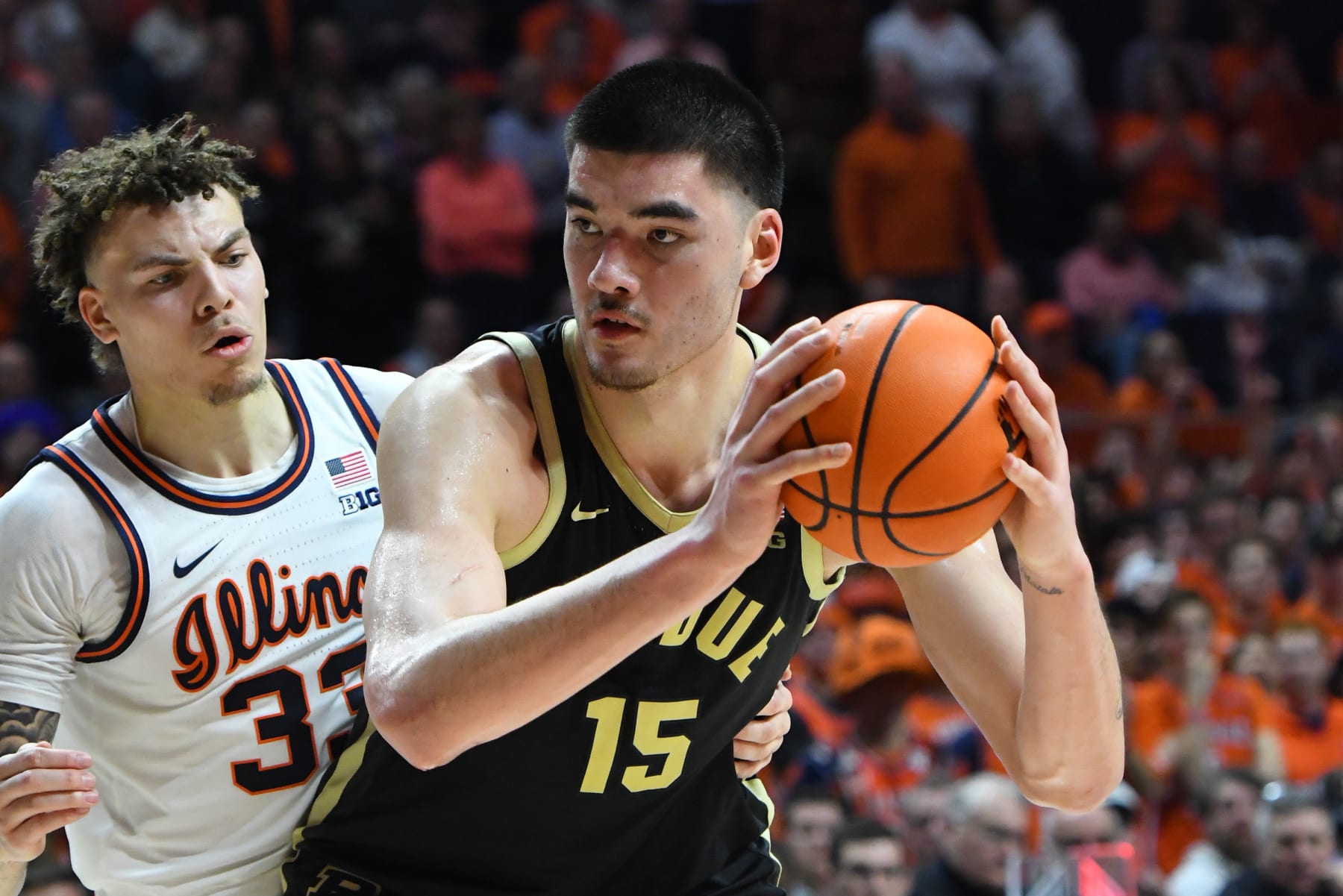 CHAMPAIGN, IL - MARCH 05: Purdue Boilermakers Center Zach Edey (15) tries to shake defender Illinois Fighting Illini Forward Coleman Hawkins (33), Tuesday, March 5, 2024, in a Big 10 Conference contest at State Farm Center in Champaign, Illinois. (Photo by David Allio/Icon Sportswire via Getty Images)