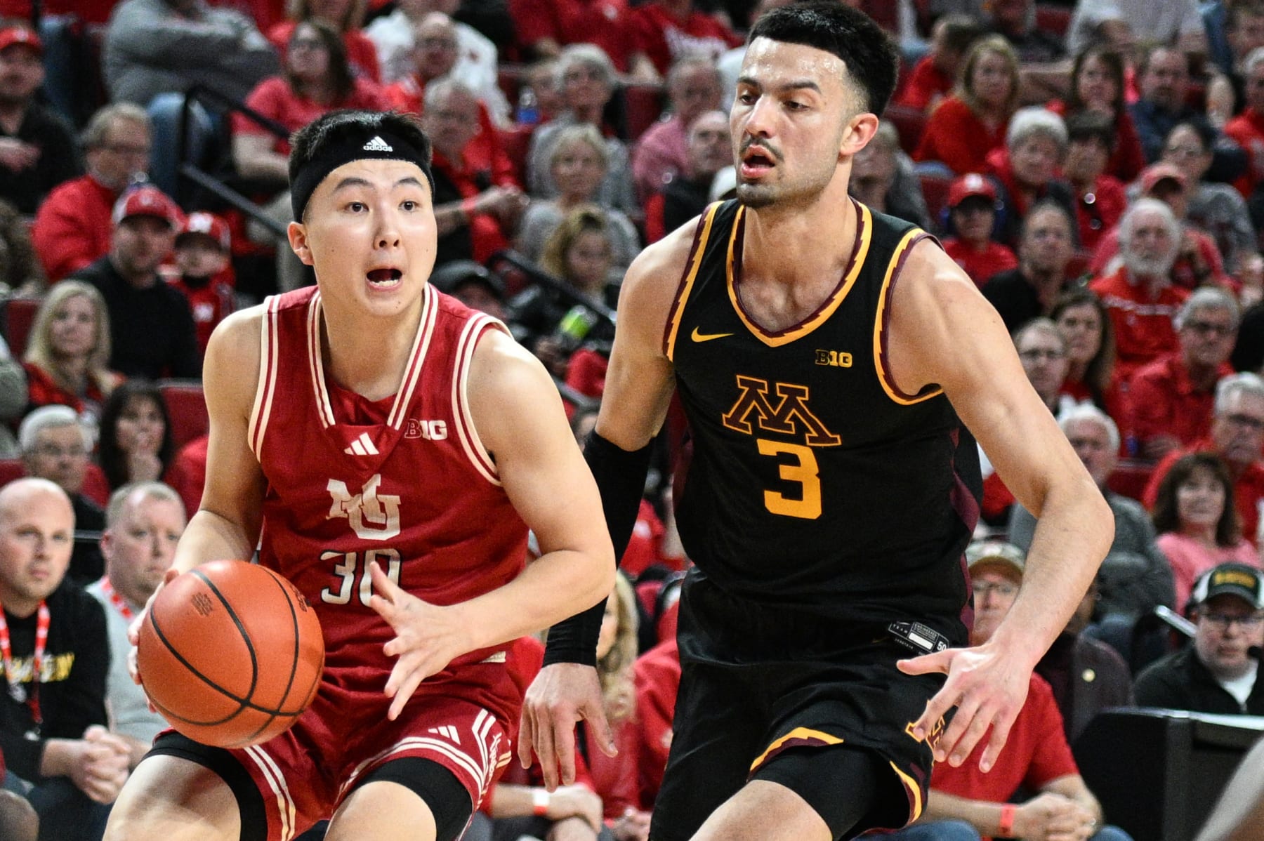 LINCOLN, NEBRASKA - FEBRUARY 25: Keisei Tominaga #30 of the Nebraska Cornhuskers drives against Dawson Garcia #3 of the Minnesota Golden Gophers in the first half at Pinnacle Bank Arena on February 25, 2024 in Lincoln, Nebraska. (Photo by Steven Branscombe/Getty Images)