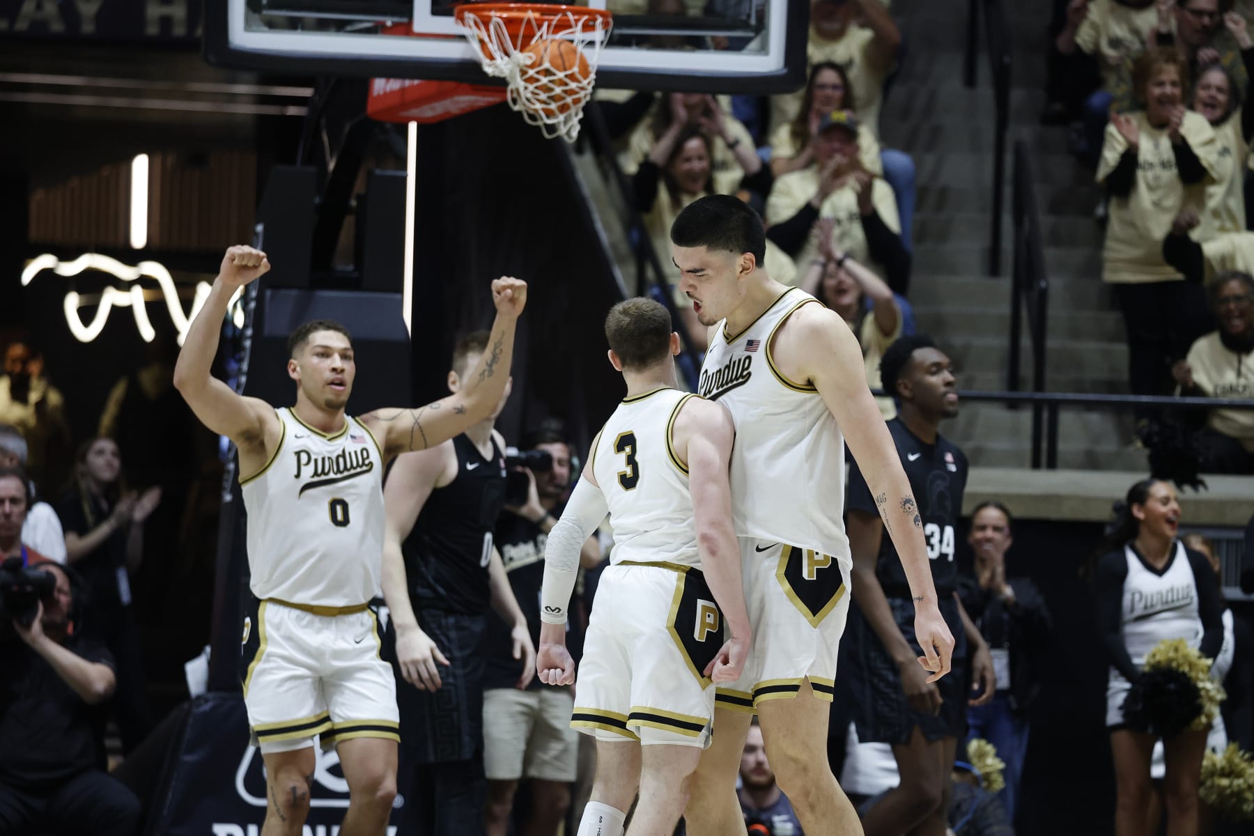 WEST LAFAYETTE, IN - MARCH 02: Purdue Boilermakers guard Braden Smith (3) give center Zach Edey (15) a chest bump during a game against the Michigan State Spartans on March 2, 2024, at Mackey Arena in West Lafayette, Indiana. (Photo by Brian Spurlock/Icon Sportswire via Getty Images)