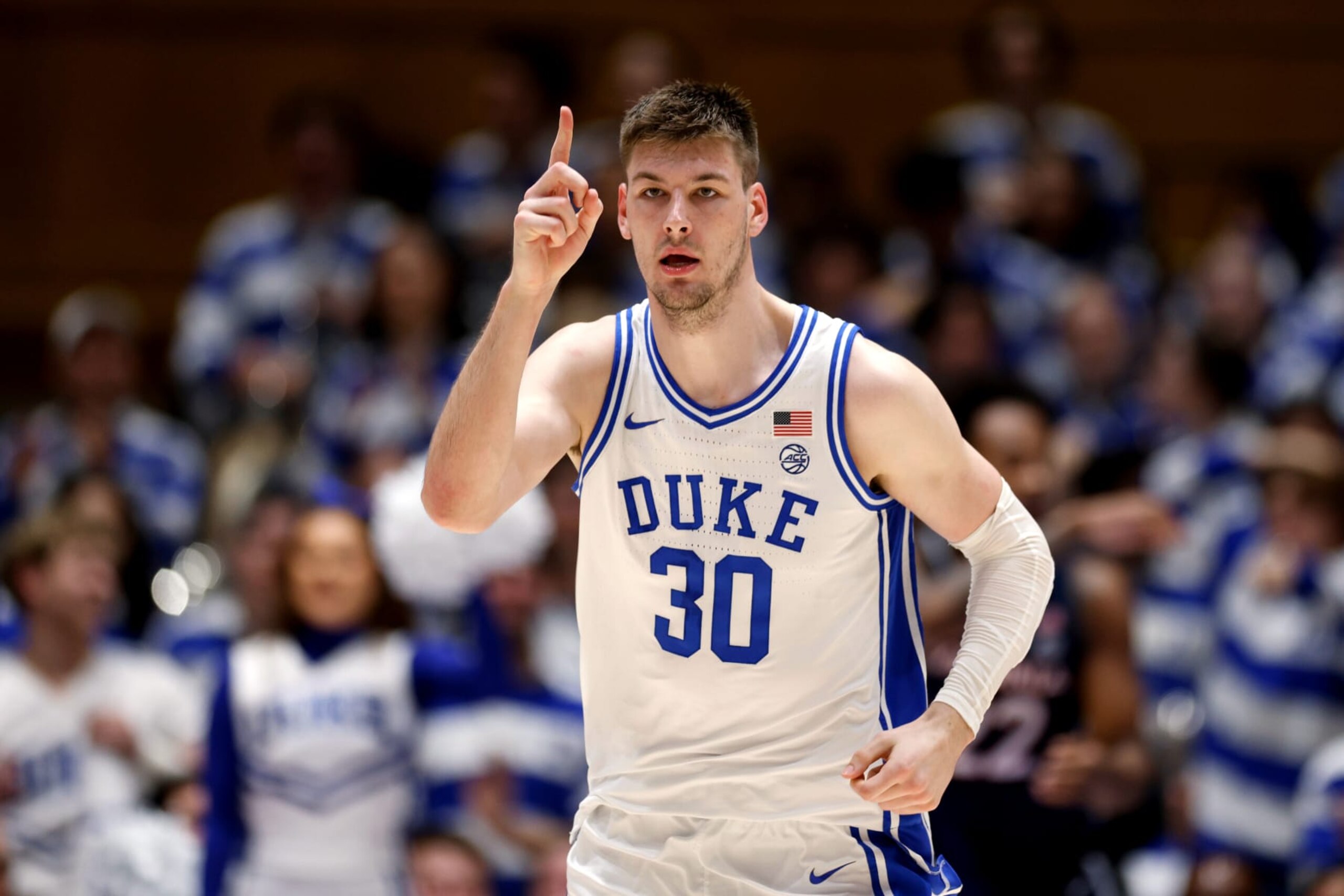 DURHAM, NORTH CAROLINA - MARCH 2: Kyle Filipowski #30 of the Duke Blue Devils reacts following a dunk against the Virginia Cavaliers at Cameron Indoor Stadium on March 2, 2024 in Durham, North Carolina. Duke won (Photo by Lance King/Getty Images)