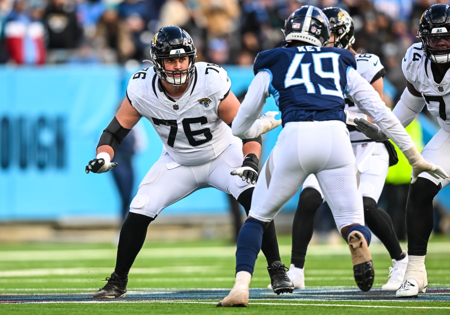NASHVILLE, TN - JANUARY 07: Jacksonville Jaguars guard Ezra Cleveland (76) blocks during the NFL game between the Tennessee Titans and the Jacksonville Jaguars on January 7, 2024, at Nissan Stadium in Nashville, TN. (Photo by Bryan Lynn/Icon Sportswire via Getty Images) NASHVILLE, TN - JANUARY 07: Jacksonville Jaguars guard Ezra Cleveland (76) blocks during the NFL game between the Tennessee Titans and the Jacksonville Jaguars on January 7, 2024, at Nissan Stadium in Nashville, TN. (Photo by Bryan Lynn/Icon Sportswire via Getty Images)