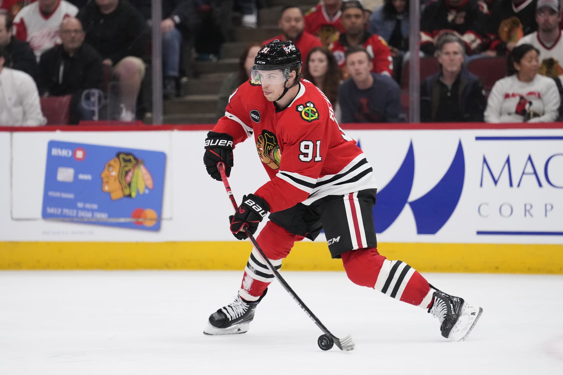 CHICAGO, ILLINOIS - FEBRUARY 25: Anthony Beauvillier #91 of the Chicago Blackhawks skates with the puck during the third period against the Detroit Red Wings at the United Center on February 25, 2024 in Chicago, Illinois. (Photo by Patrick McDermott/Getty Images)