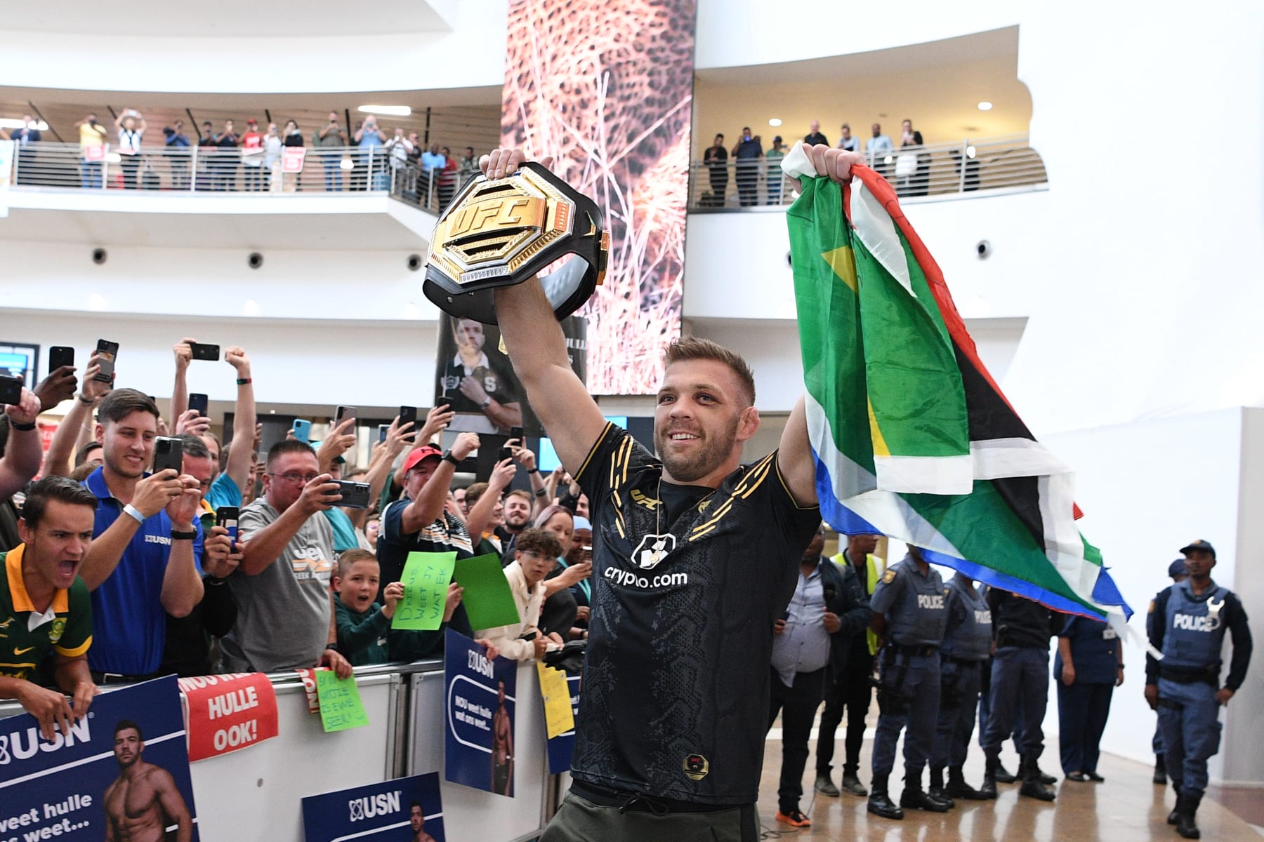 JOHANNESBURG, SOUTH AFRICA - JANUARY 25: UFC middleweight champion Dricus Du Plessis greets supporters as he arrives at O.R. Tambo International Airport on January 25, 2024 in Johannesburg, South Africa. (Photo by Lefty Shivambu/Gallo Images/Getty Images)