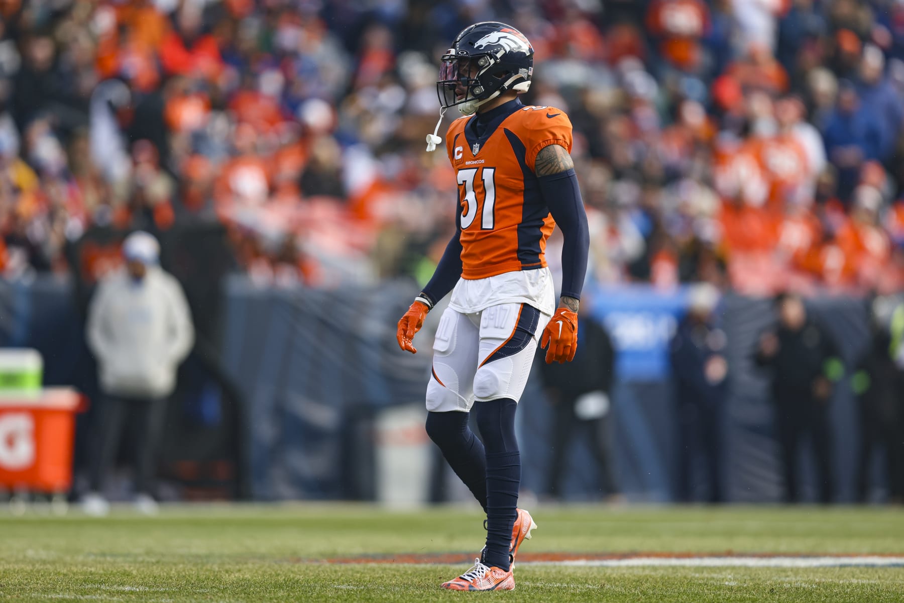 DENVER, CO - DECEMBER 31: Justin Simmons #31 of the Denver Broncos looks on from the field during an NFL football game against the Los Angeles Chargers at Empower Field at Mile High on December 31, 2023 in Denver, Colorado. (Photo by Perry Knotts/Getty Images)