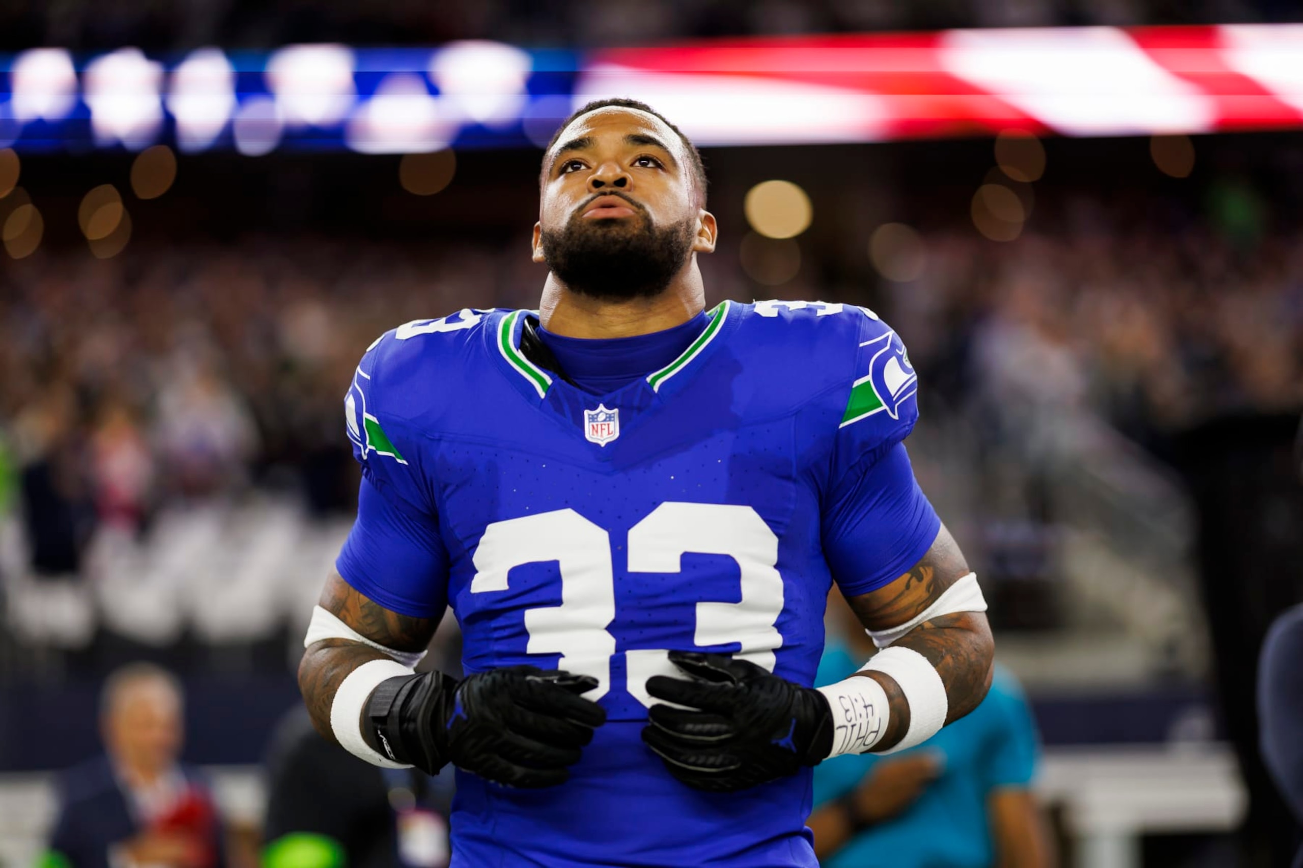 ARLINGTON, TEXAS - NOVEMBER 30: Jamal Adams #33 of the Seattle Seahawks looks on from the sideline before an NFL football game against the Dallas Cowboys at AT&T Stadium on November 30, 2023 in Arlington, Texas. (Photo by Ryan Kang/Getty Images)