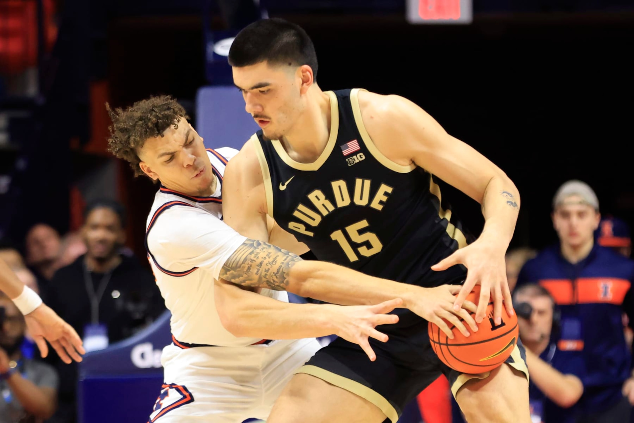 CHAMPAIGN, ILLINOIS - MARCH 05: Coleman Hawkins #33 of the Illinois Fighting Illini knocks the ball away from Zach Edey #15 of the Purdue Boilermakers during the first half at State Farm Center on March 05, 2024 in Champaign, Illinois. (Photo by Justin Casterline/Getty Images)