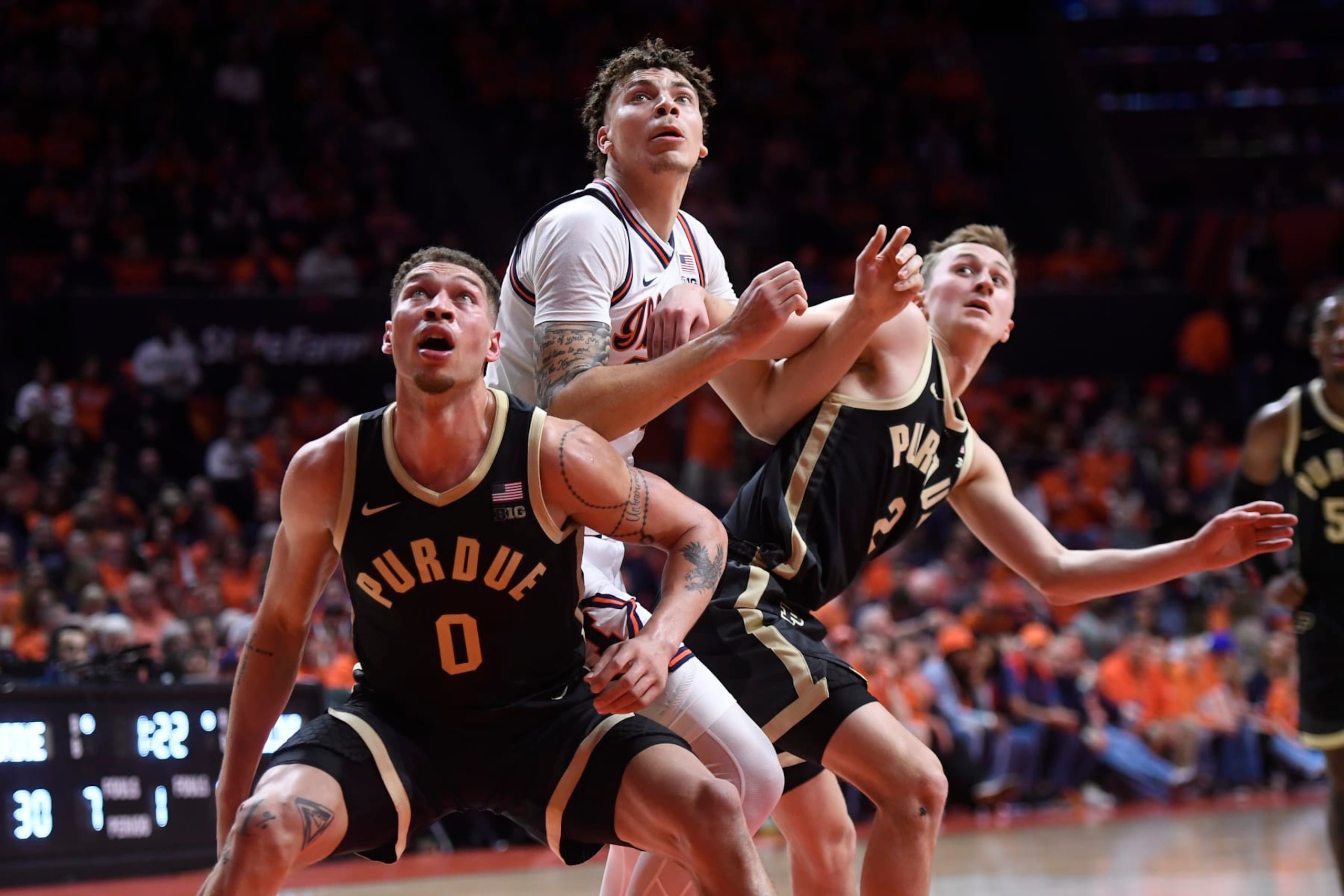CHAMPAIGN, IL - MARCH 05: Purdue Boilermakers Forward Mason Gillis (0) and Purdue Boilermakers Guard Fletcher Loyer (2) battle with Illinois Fighting Illini Forward Coleman Hawkins (33) for a rebound during the college basketball game between the Purdue Boilermakers and the Illinois Fighting Illini on March 5, 2024, at the State Farm Center in Champaign, Illinois. (Photo by Michael Allio/Icon Sportswire via Getty Images)