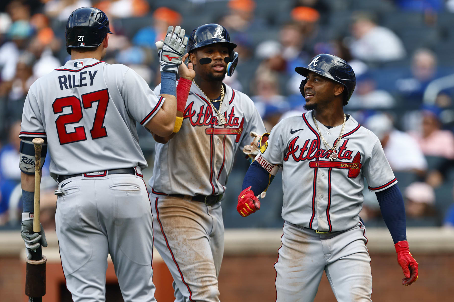 Austin Riley (L), Ronald Acuña Jr. (C) and Ozzie Albies (R)