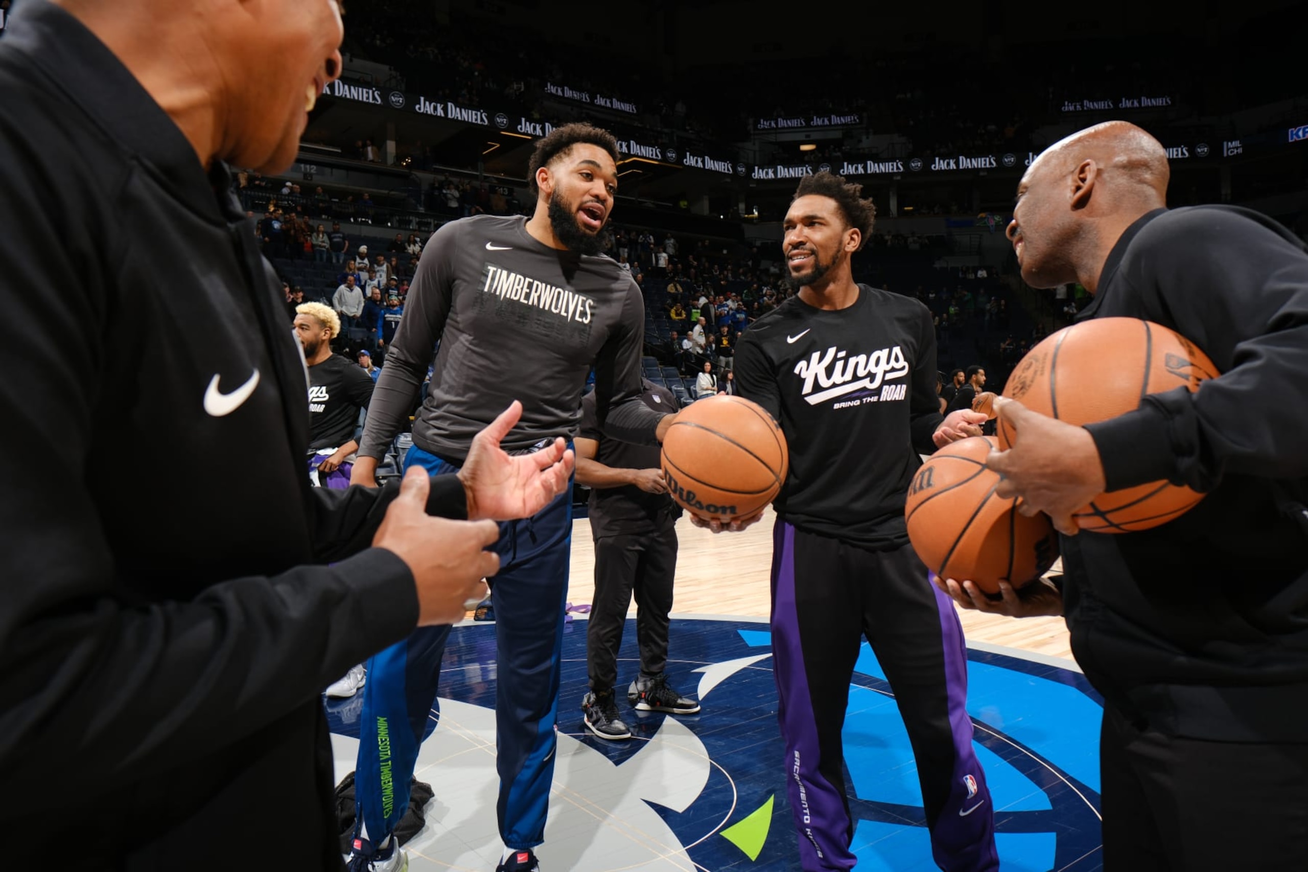MINNEAPOLIS, MN -  MARCH 1: Karl-Anthony Towns #32 of the Minnesota Timberwolves and Malik Monk #0 of the Sacramento Kings smile before the game on March 1, 2024 at Target Center in Minneapolis, Minnesota. NOTE TO USER: User expressly acknowledges and agrees that, by downloading and or using this Photograph, user is consenting to the terms and conditions of the Getty Images License Agreement. Mandatory Copyright Notice: Copyright 2024 NBAE (Photo by David Sherman/NBAE via Getty Images)