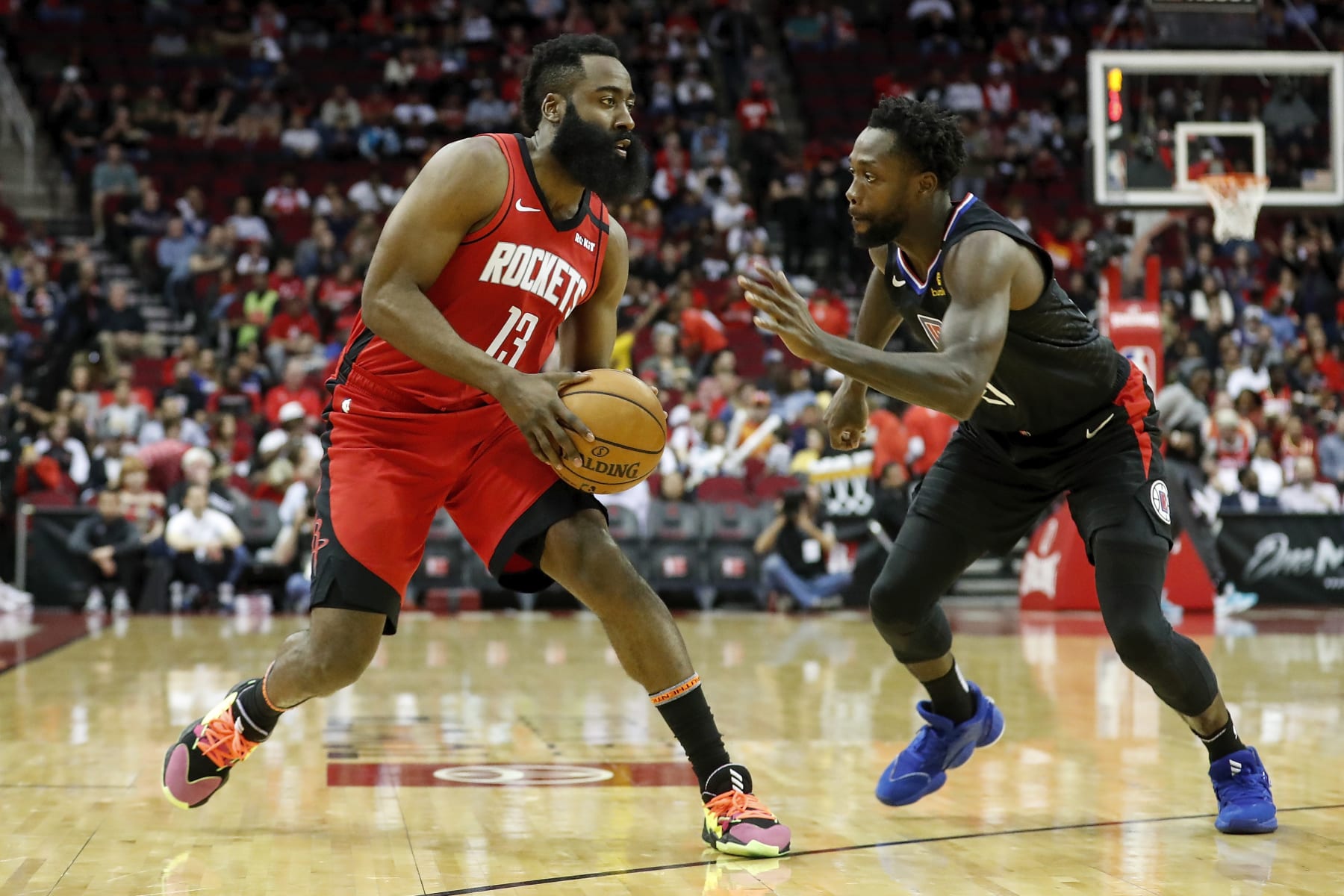 HOUSTON, TEXAS - MARCH 05: James Harden #13 of the Houston Rockets steps back for a shot while defended by Patrick Beverley #21 of the LA Clippers in the first half at Toyota Center on March 05, 2020 in Houston, Texas.  NOTE TO USER: User expressly acknowledges and agrees that, by downloading and or using this photograph, User is consenting to the terms and conditions of the Getty Images License Agreement. (Photo by Tim Warner/Getty Images)
