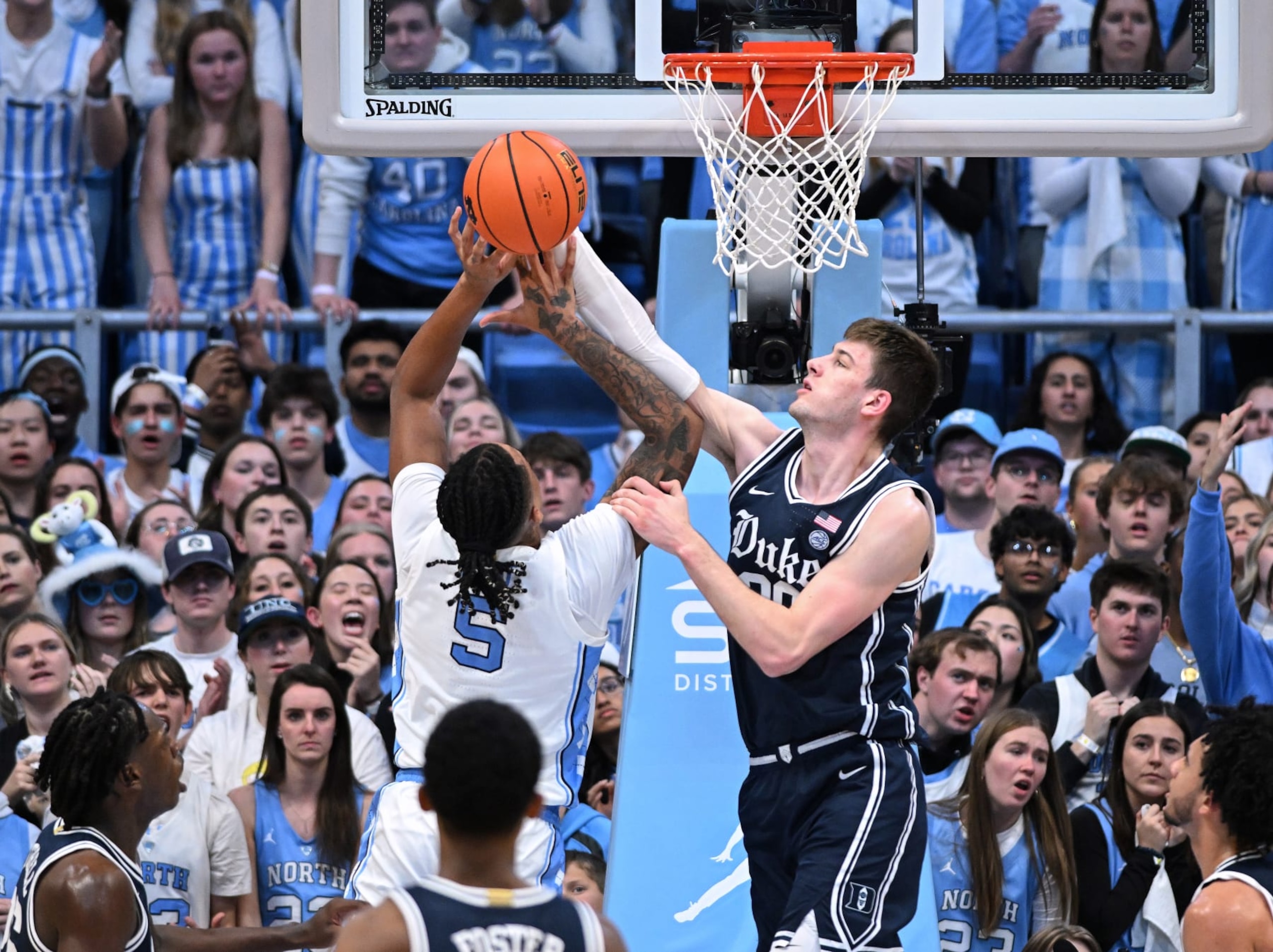 CHAPEL HILL, NORTH CAROLINA - FEBRUARY 03: Kyle Filipowski #30 of the Duke Blue Devils defends s #5 of the North Carolina Tar Heels during the game at the Dean E. Smith Center on February 03, 2024 in Chapel Hill, North Carolina. The Tar Heels won 93-84. (Photo by Grant Halverson/Getty Images) CHAPEL HILL, NORTH CAROLINA - FEBRUARY 03: Kyle Filipowski #30 of the Duke Blue Devils defends s #5 of the North Carolina Tar Heels during the game at the Dean E. Smith Center on February 03, 2024 in Chapel Hill, North Carolina. The Tar Heels won 93-84. (Photo by Grant Halverson/Getty Images)