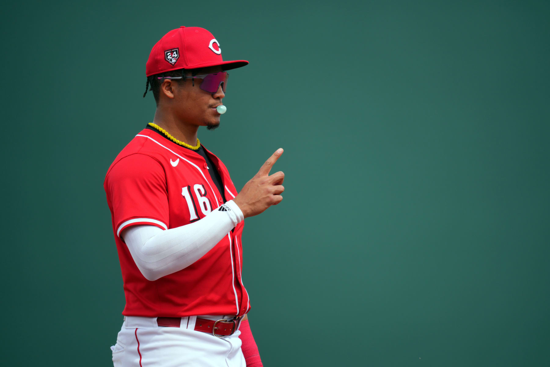 GOODYEAR, ARIZONA - MARCH 06: Noelvi Marte #16 of the Cincinnati Reds signals to teammates between batters in the second inning during a spring training game against the Milwaukee Brewers at Goodyear Ballpark on March 06, 2024 in Goodyear, Arizona. (Photo by Aaron Doster/Getty Images)