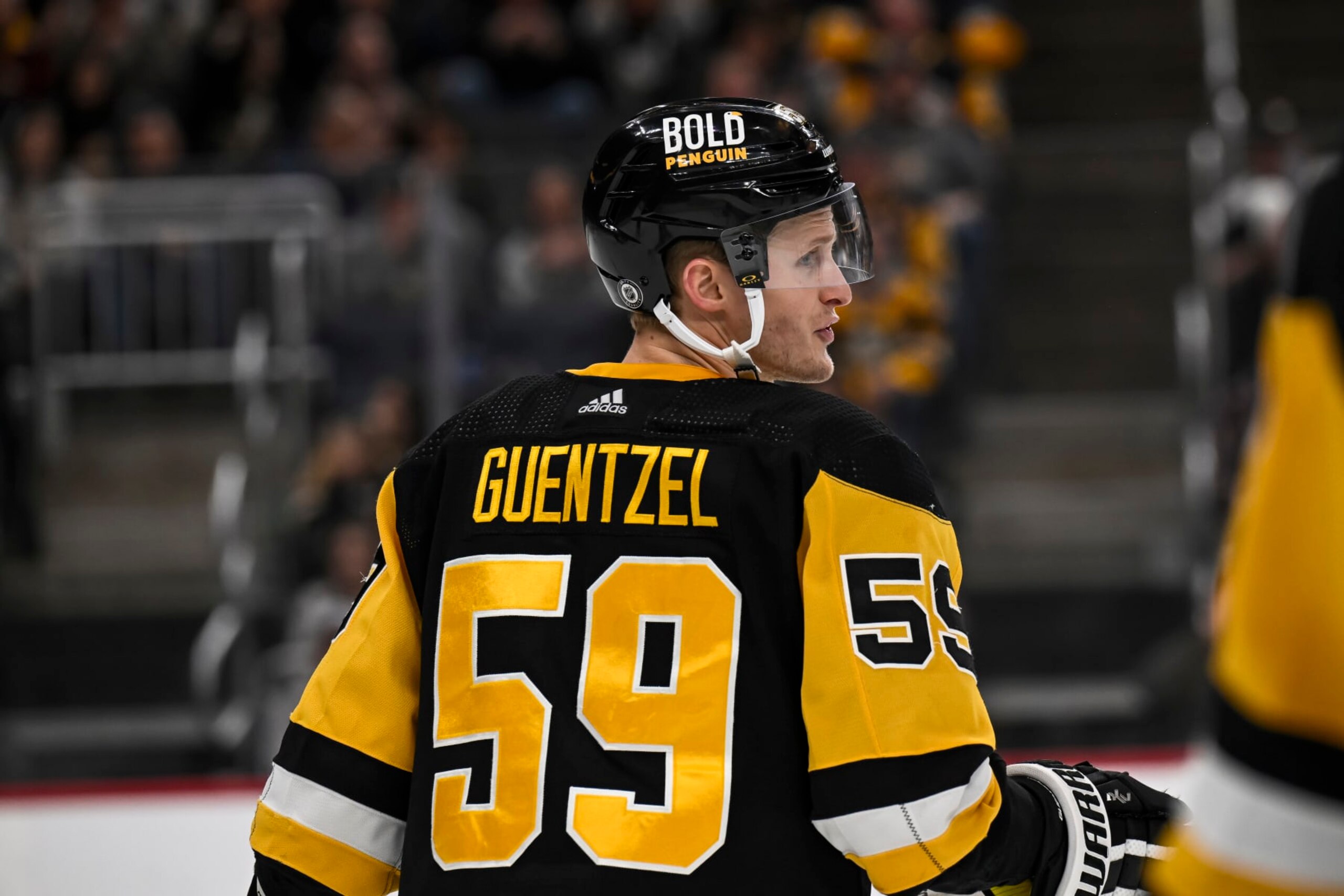 PITTSBURGH, PA - JANUARY 26: Pittsburgh Penguins left wing Jake Guentzel (59) looks on during the second period in the NHL game between the Pittsburgh Penguins and the Florida Panthers on January 26, 2024, at PPG Paints Arena in Pittsburgh, PA. (Photo by Jeanine Leech/Icon Sportswire via Getty Images)