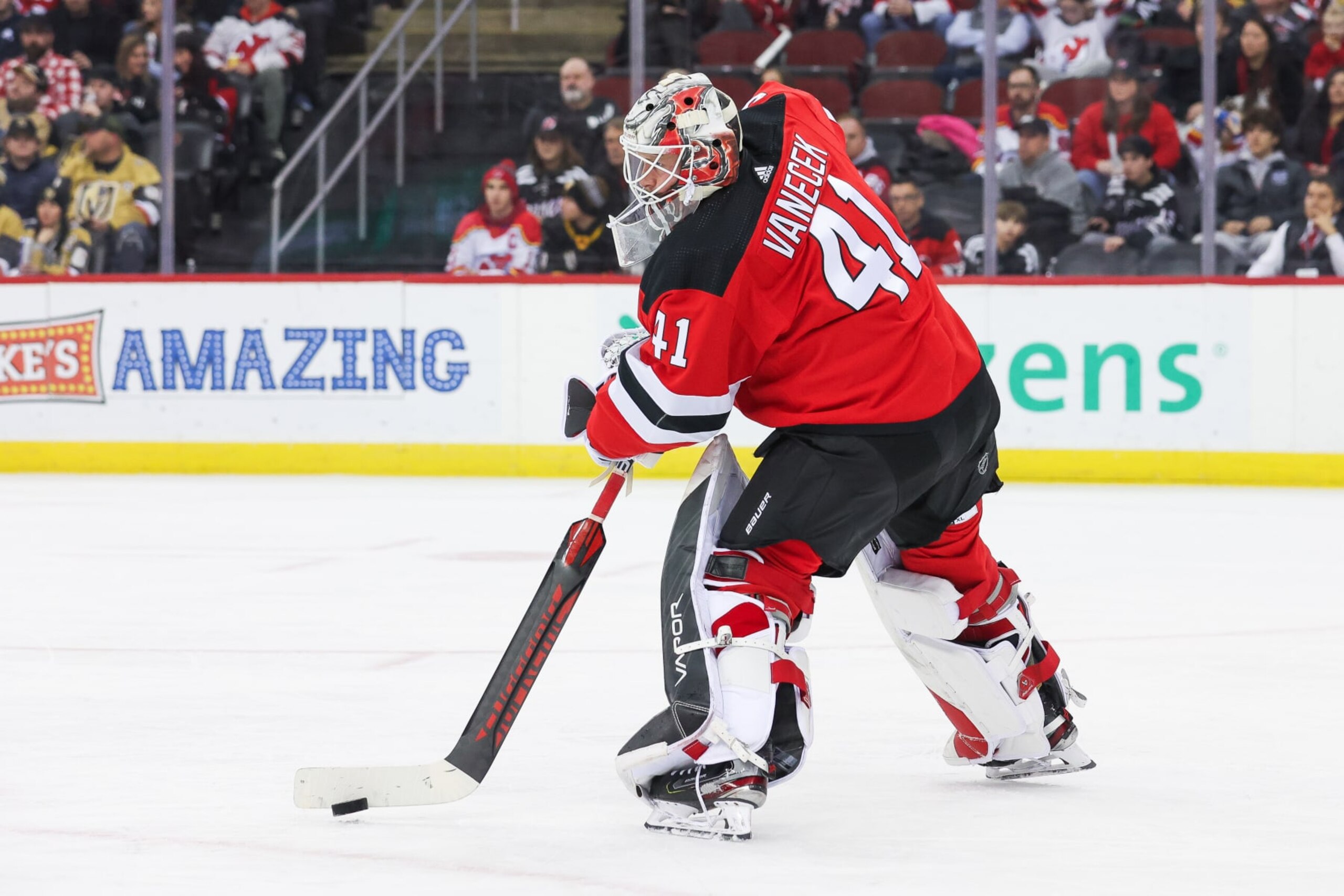 NEWARK, NJ - JANUARY 22: New Jersey Devils goaltender Vitek Vanecek (41) plays the puck during a game between the Vegas Golden Knights and New Jersey Devils on January 22, 2024 at Prudential Center in the Newark, New Jersey. (Photo by Andrew Mordzynski/Icon Sportswire via Getty Images) NEWARK, NJ - JANUARY 22: New Jersey Devils goaltender Vitek Vanecek (41) plays the puck during a game between the Vegas Golden Knights and New Jersey Devils on January 22, 2024 at Prudential Center in the Newark, New Jersey. (Photo by Andrew Mordzynski/Icon Sportswire via Getty Images)