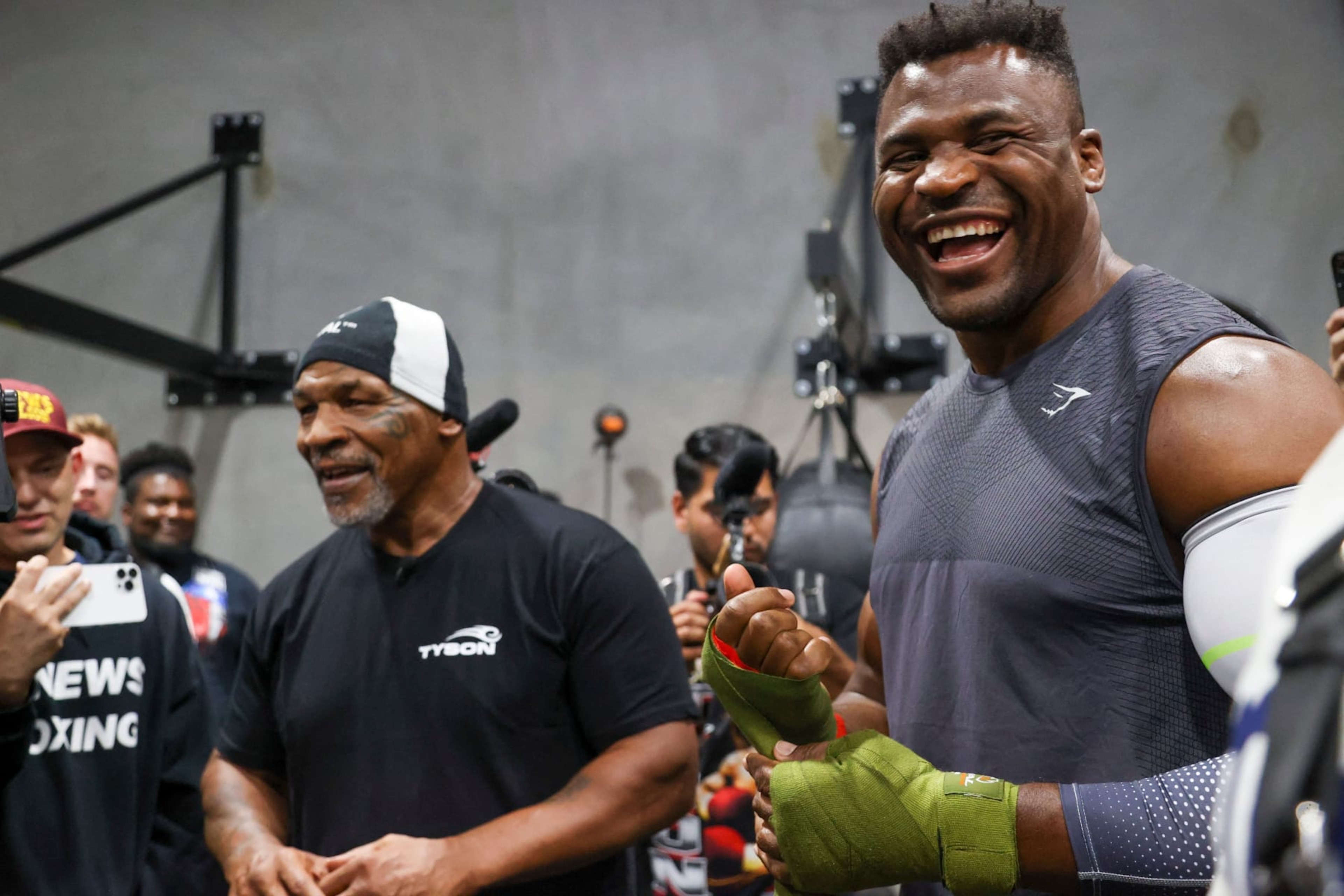 Former US boxer Mike Tyson (L) and Cameroonian-French mixed martial arts star and boxer Francis Ngannou laugh while talking to media before a training session at Ngannou's gym in Las Vegas, Nevada on September 26, 2023. Mixed martial arts star Francis Ngannou will have heavyweight legend Mike Tyson in his corner when he faces World Boxing Council heavyweight champion Tyson Fury in the boxing ring in Saudi Arabia on October 28. (Photo by Ian Maule / AFP) (Photo by IAN MAULE/AFP via Getty Images) Former US boxer Mike Tyson (L) and Cameroonian-French mixed martial arts star and boxer Francis Ngannou laugh while talking to media before a training session at Ngannou's gym in Las Vegas, Nevada on September 26, 2023. Mixed martial arts star Francis Ngannou will have heavyweight legend Mike Tyson in his corner when he faces World Boxing Council heavyweight champion Tyson Fury in the boxing ring in Saudi Arabia on October 28. (Photo by Ian Maule / AFP) (Photo by IAN MAULE/AFP via Getty Images)