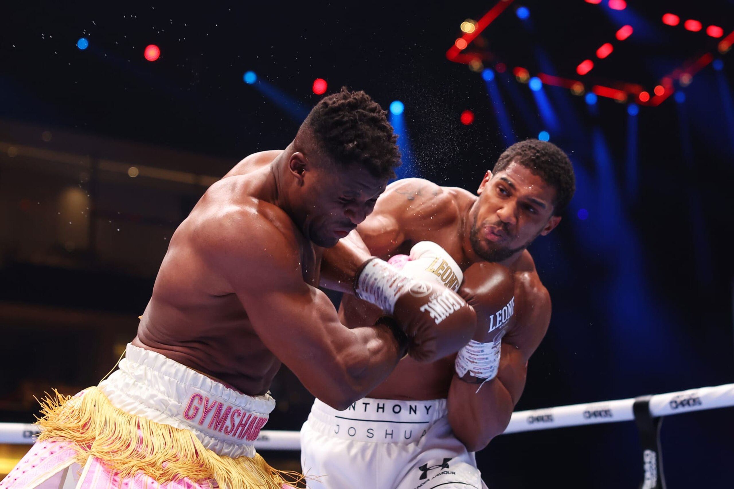 RIYADH, SAUDI ARABIA - MARCH 08: Anthony Joshua punches Francis Ngannou during the Heavyweight fight between Anthony Joshua and Francis Ngannou on the Knockout Chaos boxing card at the Kingdom Arena on March 08, 2024 in Riyadh, Saudi Arabia. (Photo by Richard Pelham/Getty Images) RIYADH, SAUDI ARABIA - MARCH 08: Anthony Joshua punches Francis Ngannou during the Heavyweight fight between Anthony Joshua and Francis Ngannou on the Knockout Chaos boxing card at the Kingdom Arena on March 08, 2024 in Riyadh, Saudi Arabia. (Photo by Richard Pelham/Getty Images)