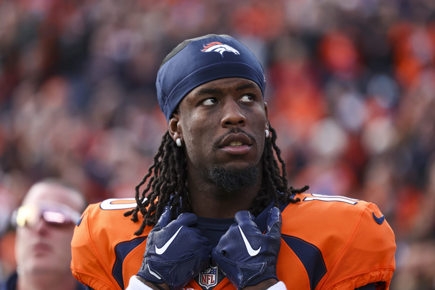 DENVER, CO - DECEMBER 31: Jerry Jeudy #10 of the Denver Broncos looks on from the sideline during the antional anthem prior to an NFL football game against the Los Angeles Chargers at Empower Field at Mile High on December 31, 2023 in Denver, Colorado. (Photo by Perry Knotts/Getty Images)