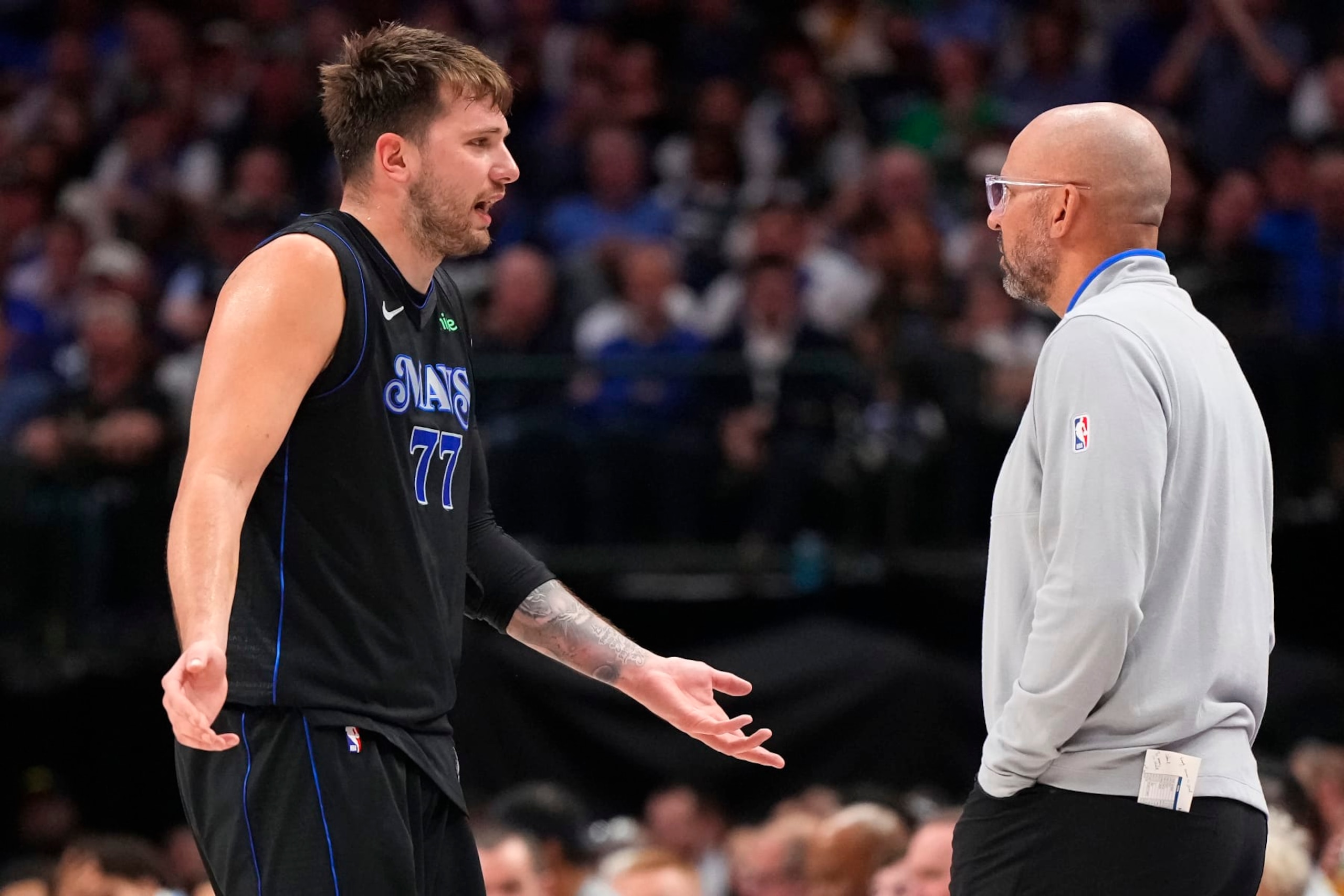 DALLAS, TEXAS - MARCH 03: Luka Doncic #77 of the Dallas Mavericks talks to head coach Jason Kidd during the second half against the Philadelphia 76ers at American Airlines Center on March 03, 2024 in Dallas, Texas. NOTE TO USER: User expressly acknowledges and agrees that, by downloading and or using this photograph, User is consenting to the terms and conditions of the Getty Images License Agreement. (Photo by Sam Hodde/Getty Images)