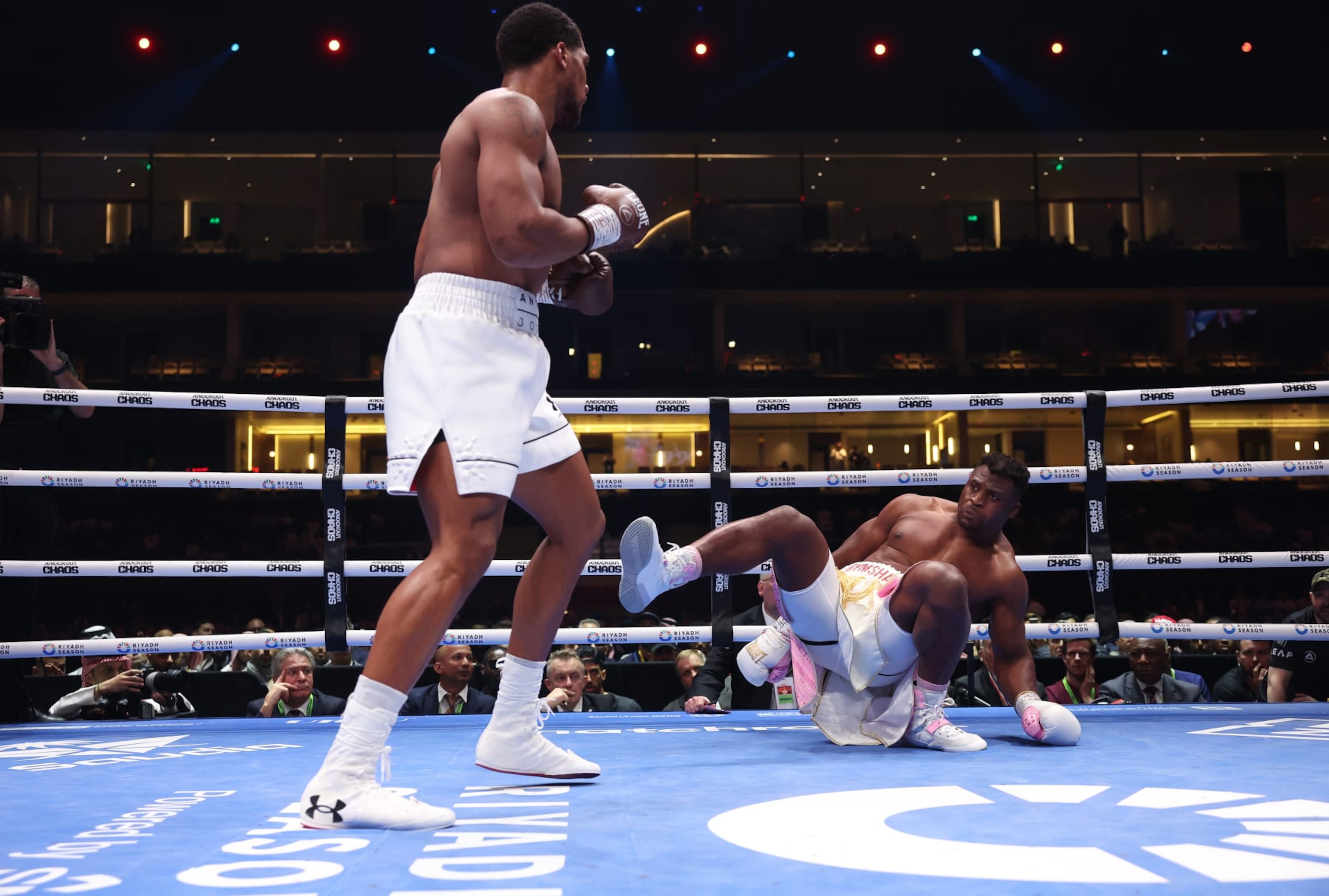 RIYADH, SAUDI ARABIA - MARCH 8: Anthony Joshua knocks down Francis N'Gannou for the 1st time during their Heavyweight Contest at Kingdom Arena on March 8, 2024 in Riyadh, Saudi Arabia. (Photo by Mark Robinson/Matchroom Boxing via Getty Images) RIYADH, SAUDI ARABIA - MARCH 8: Anthony Joshua knocks down Francis N'Gannou for the 1st time during their Heavyweight Contest at Kingdom Arena on March 8, 2024 in Riyadh, Saudi Arabia. (Photo by Mark Robinson/Matchroom Boxing via Getty Images)