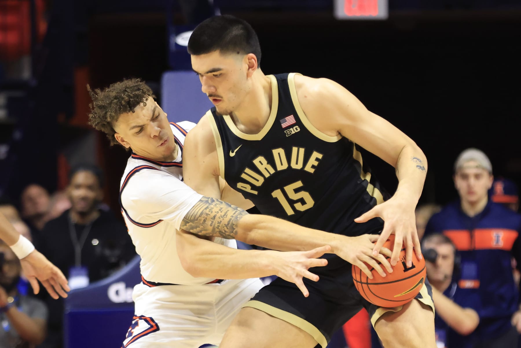 CHAMPAIGN, ILLINOIS - MARCH 05: Coleman Hawkins #33 of the Illinois Fighting Illini knocks the ball away from Zach Edey #15 of the Purdue Boilermakers during the first half at State Farm Center on March 05, 2024 in Champaign, Illinois. (Photo by Justin Casterline/Getty Images)