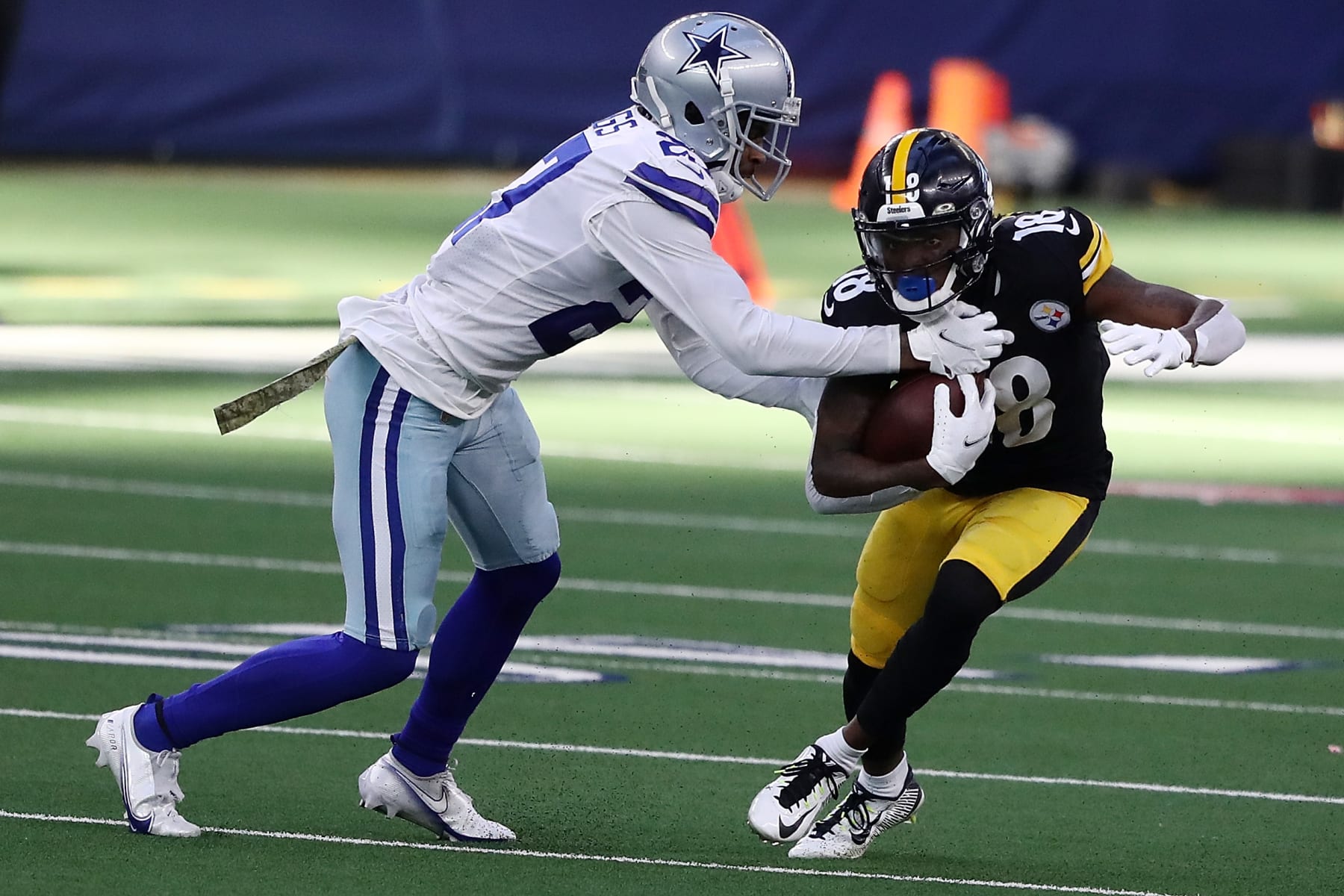 ARLINGTON, TEXAS - NOVEMBER 08:  Diontae Johnson #18 of the Pittsburgh Steelers catches a pass in front of Trevon Diggs #27 of the Dallas Cowboys during the first half at AT&T Stadium on November 08, 2020 in Arlington, Texas. (Photo by Ronald Martinez/Getty Images)