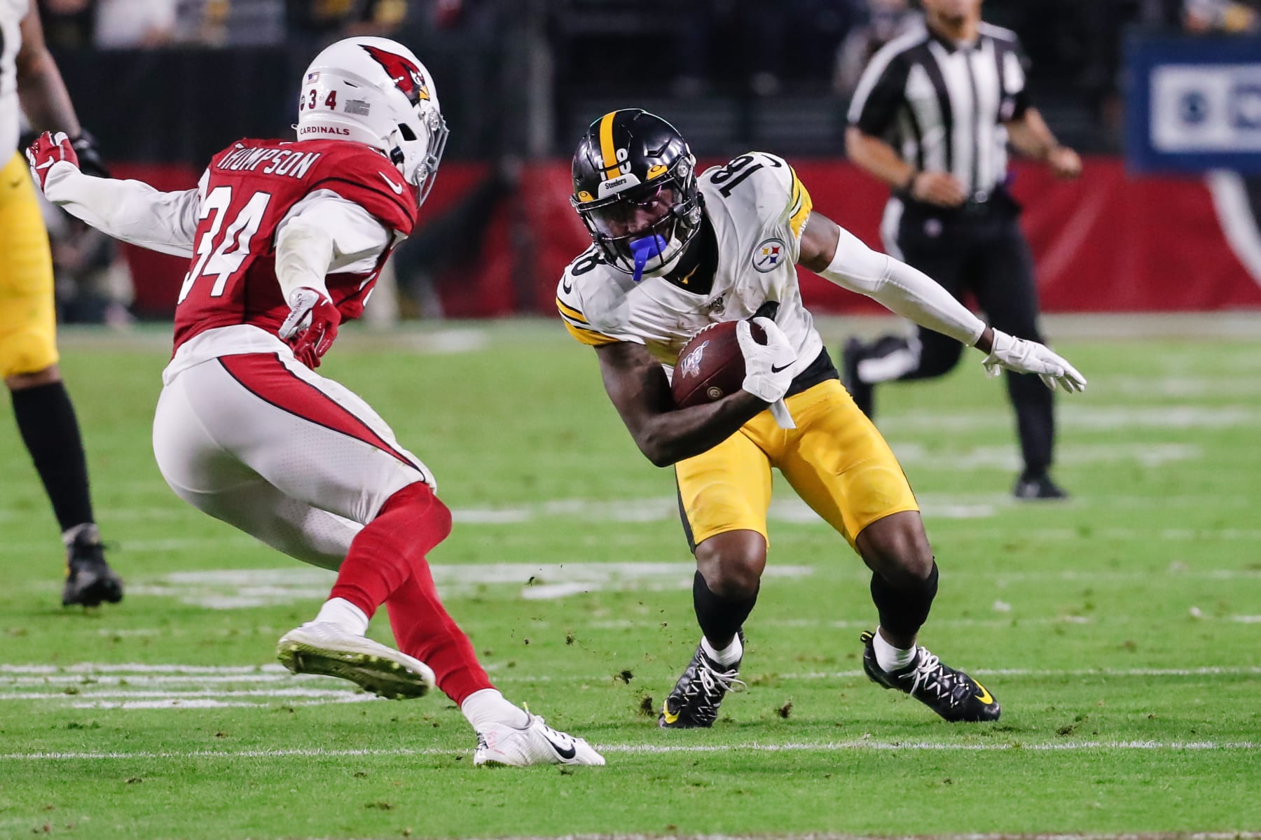GLENDALE, AZ - DECEMBER 08:  Pittsburgh Steelers wide receiver Diontae Johnson (18) makes a move on Arizona Cardinals strong safety Jalen Thompson (34) during the NFL football game between the Pittsburgh Steelers and the Arizona Cardinals on December 8, 2019 at State Farm Stadium in Glendale, Arizona. (Photo by Kevin Abele/Icon Sportswire via Getty Images)