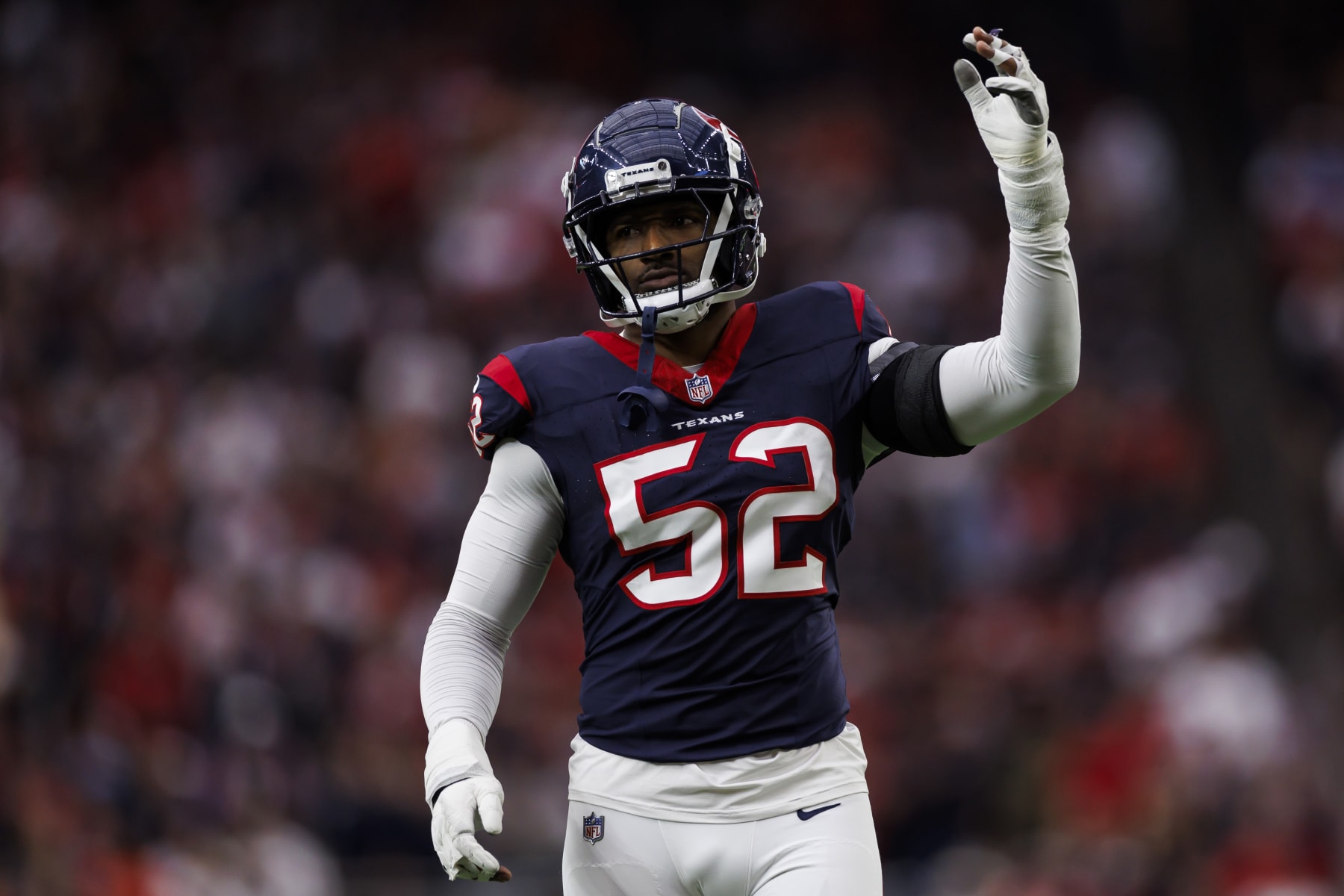 HOUSTON, TEXAS - JANUARY 13: Jonathan Greenard #52 of the Houston Texans celebrates during an AFC wild-card playoff football game against the Cleveland Browns at NRG Stadium on January 13, 2024 in Houston, Texas. (Photo by Ryan Kang/Getty Images)