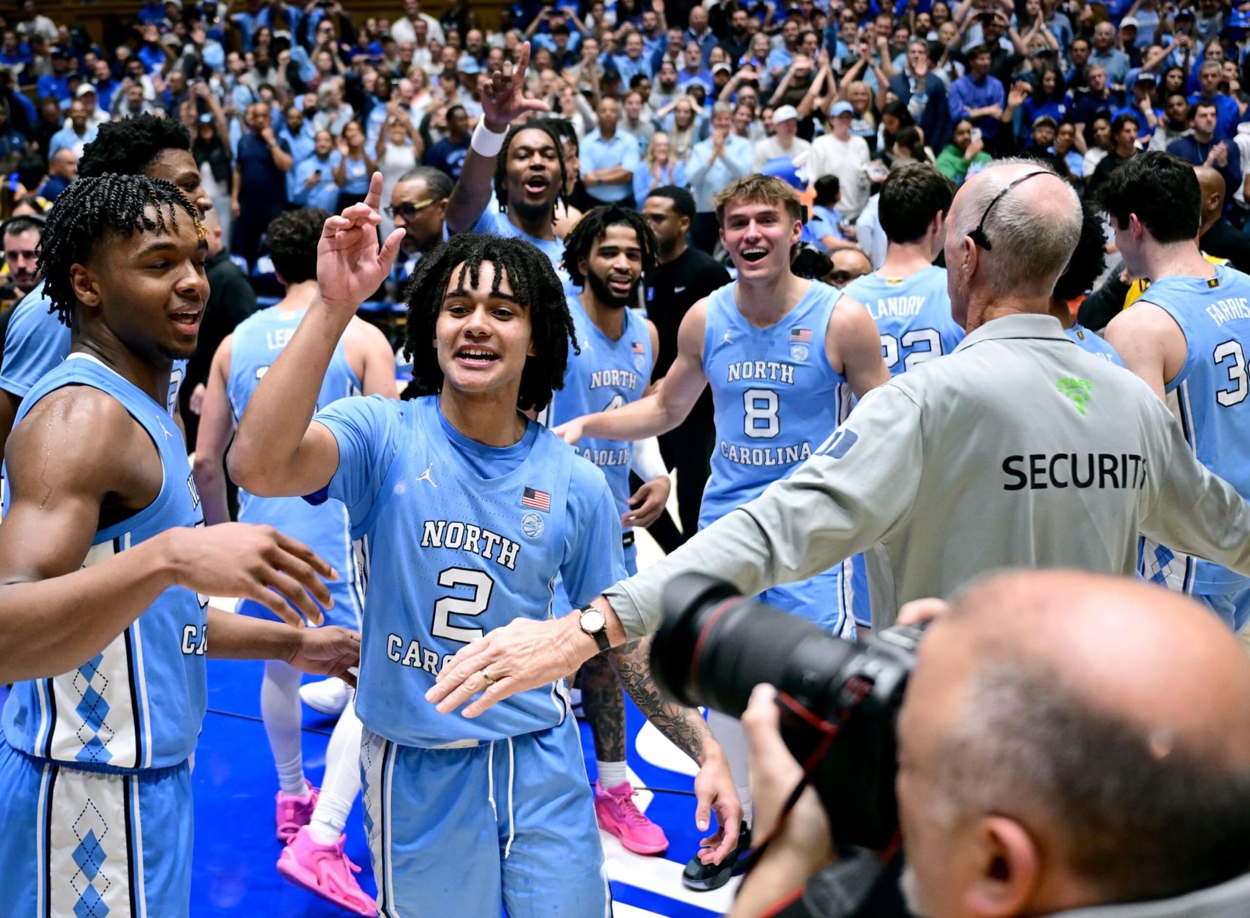 DURHAM, NORTH CAROLINA - MARCH 09: Elliot Cadeau #2 and the North Carolina Tar Heels wave goodbye to the fans as they leave the floor after a win against the Duke Blue Devils at Cameron Indoor Stadium on March 09, 2024 in Durham, North Carolina.The Tar Heels won 84-79. (Photo by Grant Halverson/Getty Images)