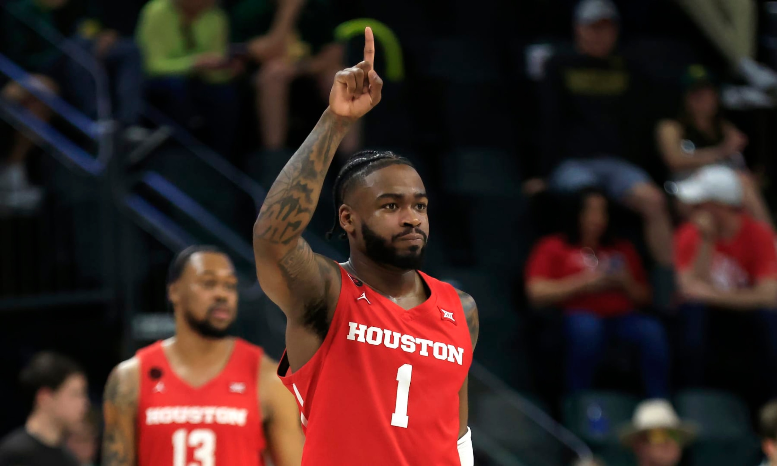WACO, TX - FEBRUARY 24: Jamal Shead #1 of the Houston Cougars  celebrates in the final seconds of the team's victory over the Baylor Bears in over time at Foster Pavilion on February 24, 2024 in Waco, Texas. (Photo by Ron Jenkins/Getty Images)