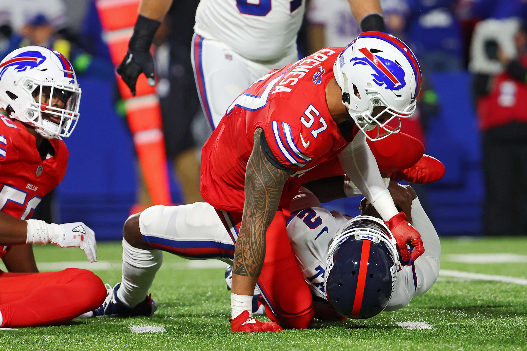 ORCHARD PARK, NEW YORK - OCTOBER 15: AJ Epenesa #57 of the Buffalo Bills sacked Tyrod Taylor #2 of the New York Giants in the first quarter of a game at Highmark Stadium on October 15, 2023 in Orchard Park, New York. (Photo by Timothy T Ludwig/Getty Images)