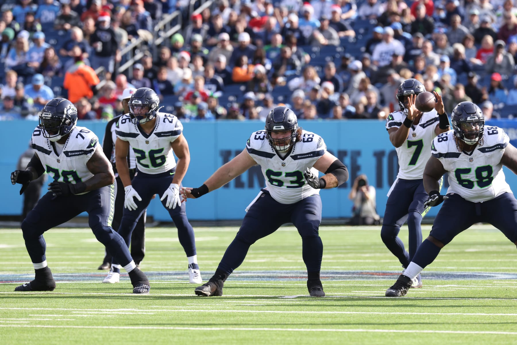 NASHVILLE, TN - DECEMBER 24: Seattle Seahawks offensive tackle Jason Peters (70), running back Zach Charbonnet (26), center Evan Brown (63), and guard Damien Lewis (68) block as Seattle Seahawks quarterback Geno Smith (7) takes a snap during a game between the Tennessee Titans and Seattle Seahawks, December 24, 2023 at Nissan Stadium in Nashville, Tennessee. (Photo by Matthew Maxey/Icon Sportswire via Getty Images)