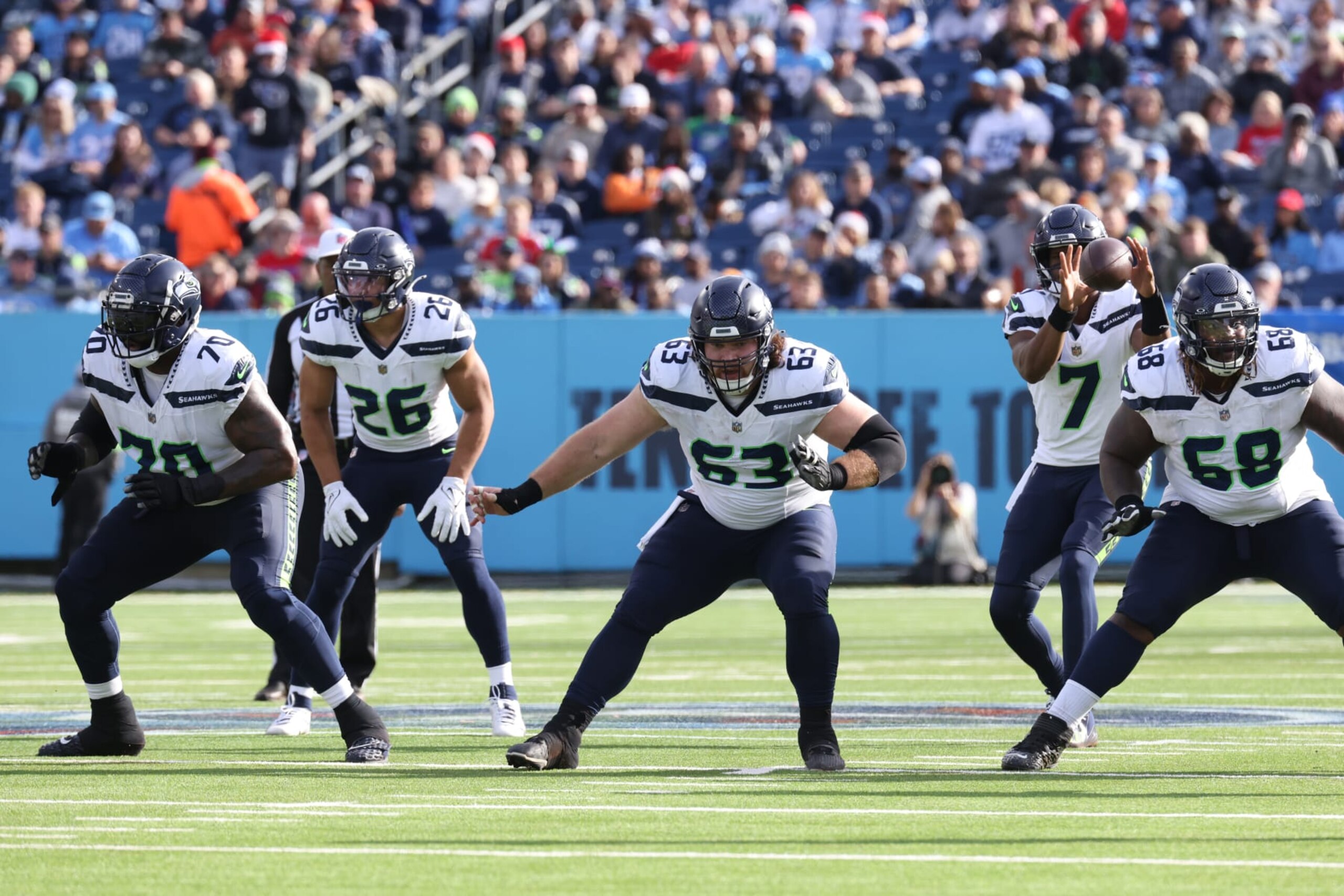 NASHVILLE, TN - DECEMBER 24: Seattle Seahawks offensive tackle Jason Peters (70), running back Zach Charbonnet (26), center Evan Brown (63), and guard Damien Lewis (68) block as Seattle Seahawks quarterback Geno Smith (7) takes a snap during a game between the Tennessee Titans and Seattle Seahawks, December 24, 2023 at Nissan Stadium in Nashville, Tennessee. (Photo by Matthew Maxey/Icon Sportswire via Getty Images)