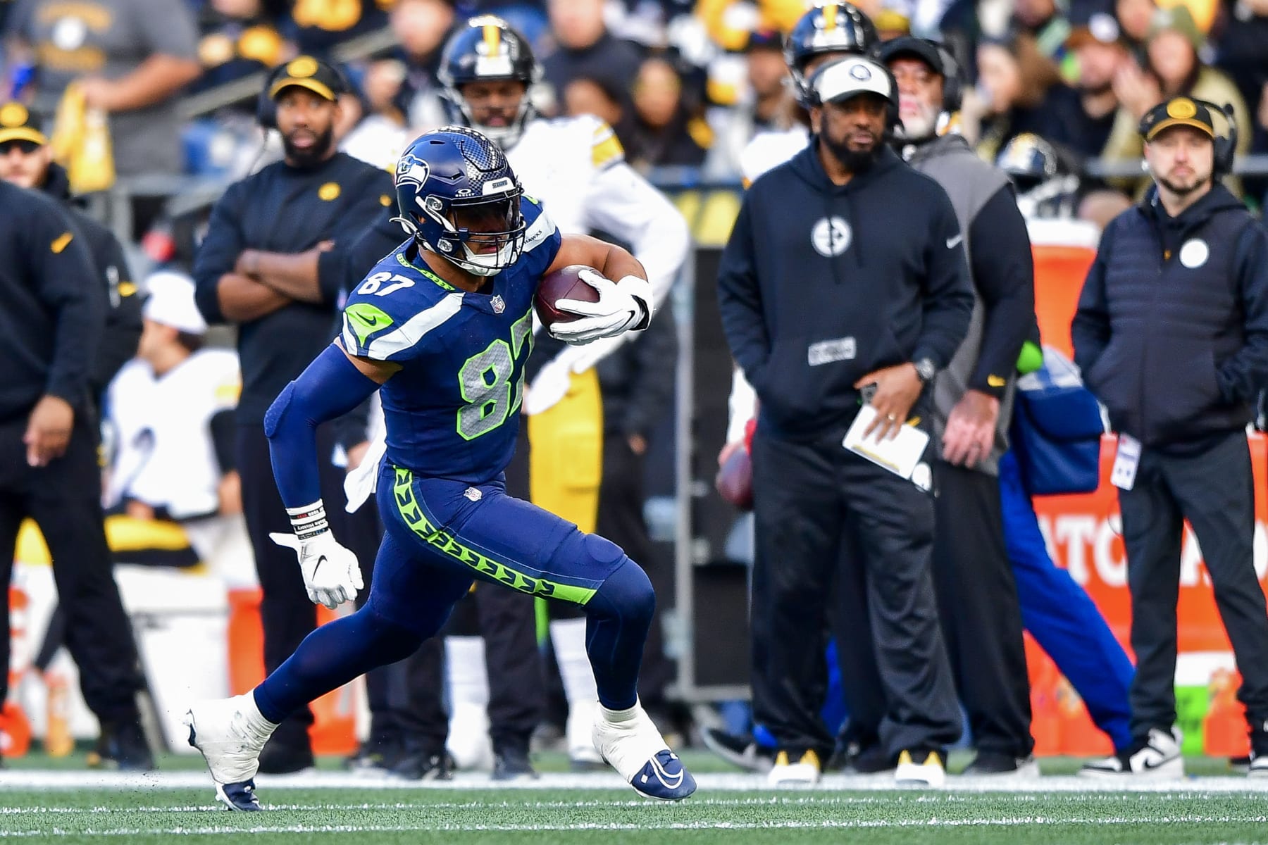 SEATTLE, WASHINGTON - DECEMBER 31: Noah Fant #87 of the Seattle Seahawks runs for a first down during the third quarter of a game against the Pittsburgh Steelers at Lumen Field on December 31, 2023 in Seattle, Washington. (Photo by Jane Gershovich/Getty Images)