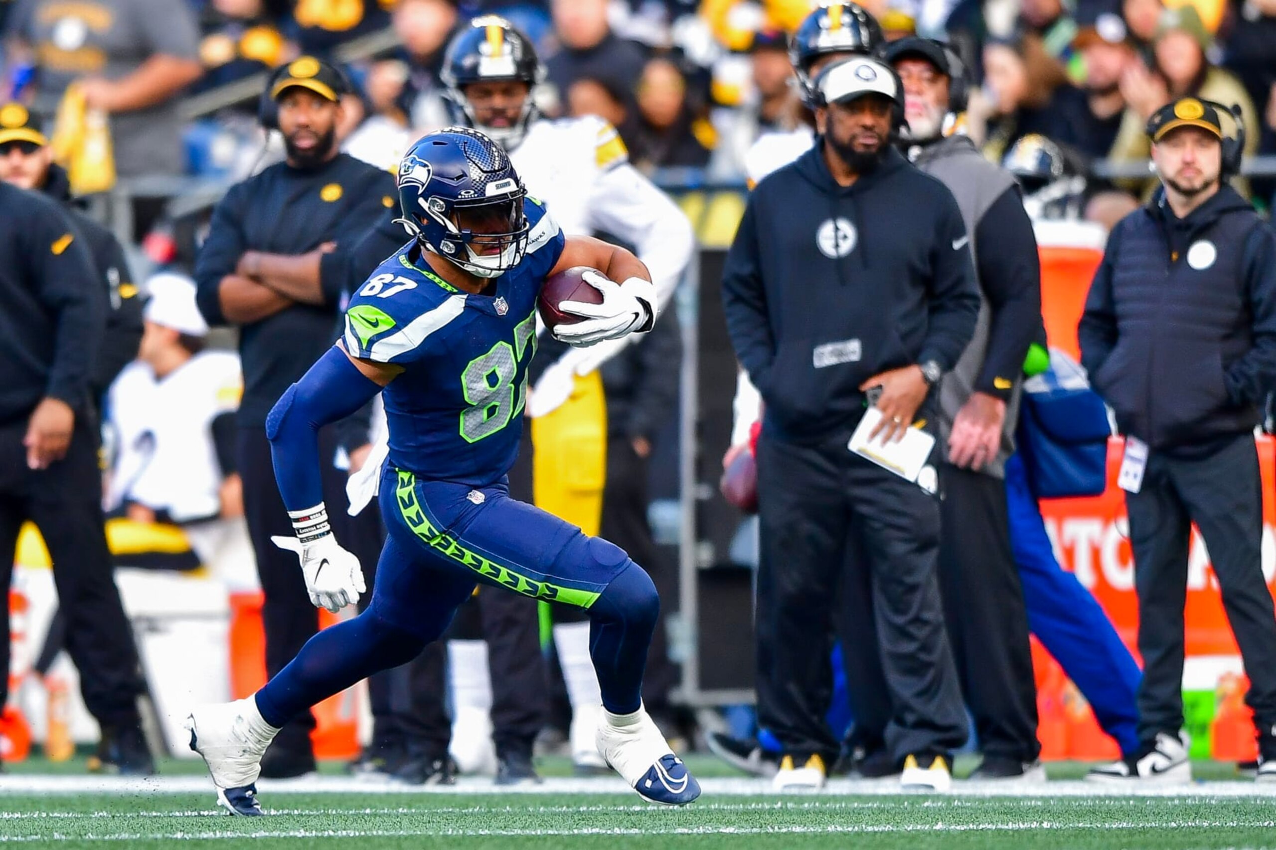 SEATTLE, WASHINGTON - DECEMBER 31: Noah Fant #87 of the Seattle Seahawks runs for a first down during the third quarter of a game against the Pittsburgh Steelers at Lumen Field on December 31, 2023 in Seattle, Washington. (Photo by Jane Gershovich/Getty Images)